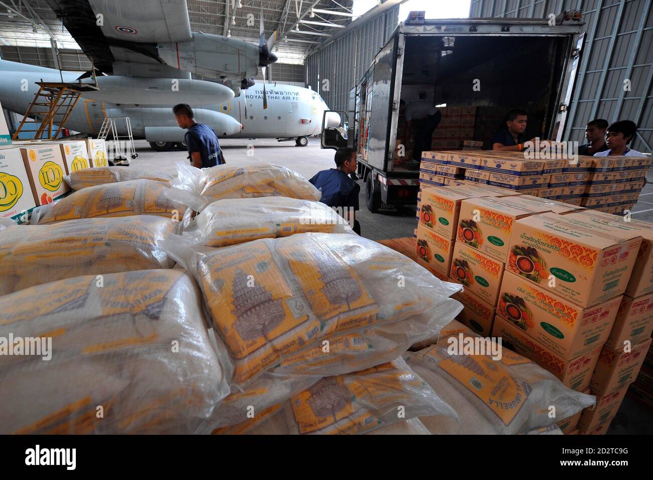 Thai air force personnel load food and disaster supplies for shipment to  Myanmar at the military airport in Bangkok May 7, 2008. Disease, hunger and  thirst pose a major threat to hundreds