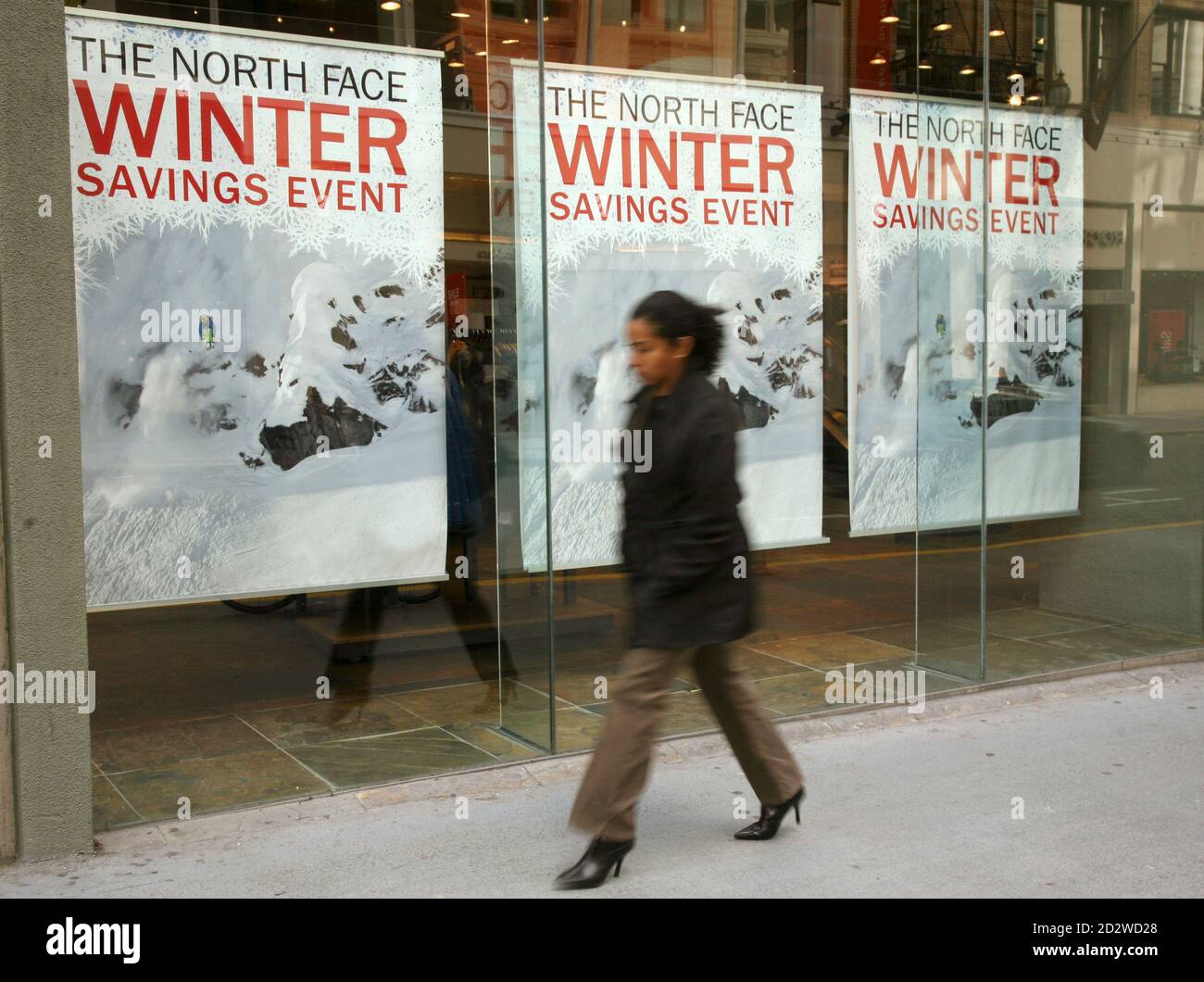 A pedestrian walks past a North Face retail store in San Francisco,  California February 10, 2009. Apparel maker VF Corp reported fourth-quarter  earnings that topped analysts' lowered estimates and said it expects