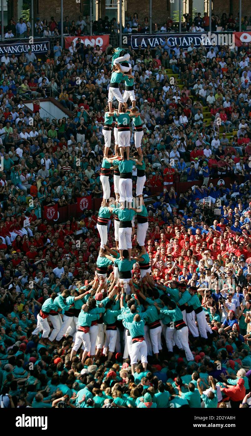 The group 'Castellers de Vilafranca' form a human tower called 'castell'  during a biannual competition in the northeastern Spanish city of Tarragona  October 1, 2006. The formation of human towers is a
