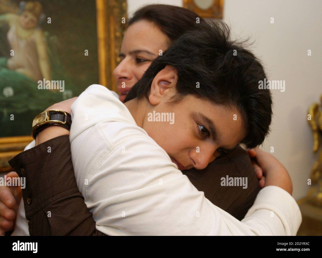 Amin al-Khansa, who was kidnapped by a Lebanese gang, hugs his mother at  his home after being rescued by Lebanese security forces in Beirut April 2,  2009. Khansa, a 14-year-old student, was