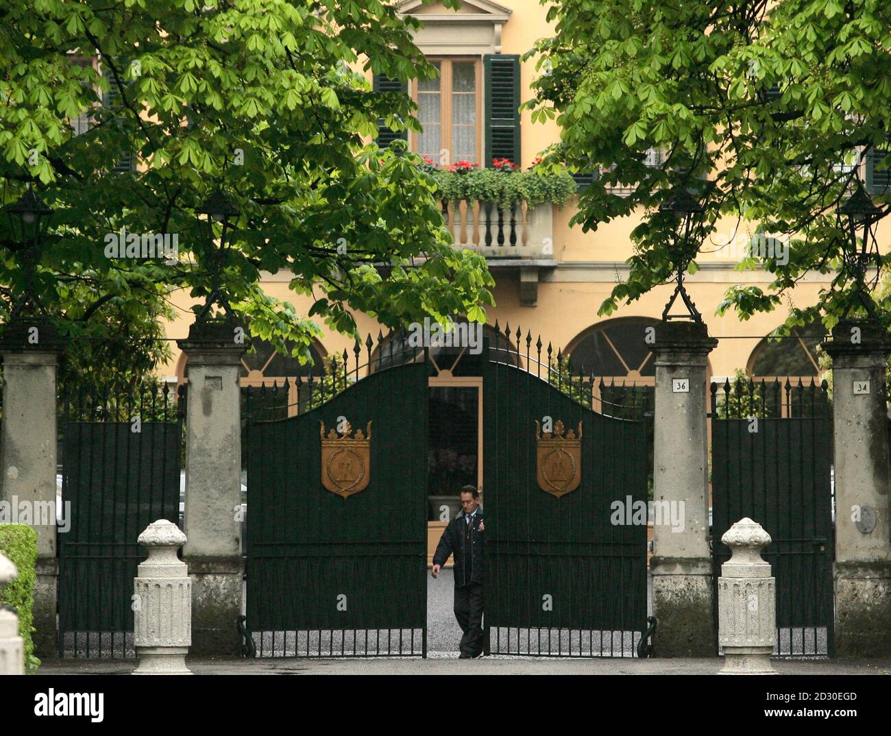A Guard Closes The Gate Of Italian Centre Right Leader Silvio Berlusconi S Villa In Arcore Near Milan April 14 08 Italians Voted In The Final Hours Of A Two Day Parliamentary Election That Could