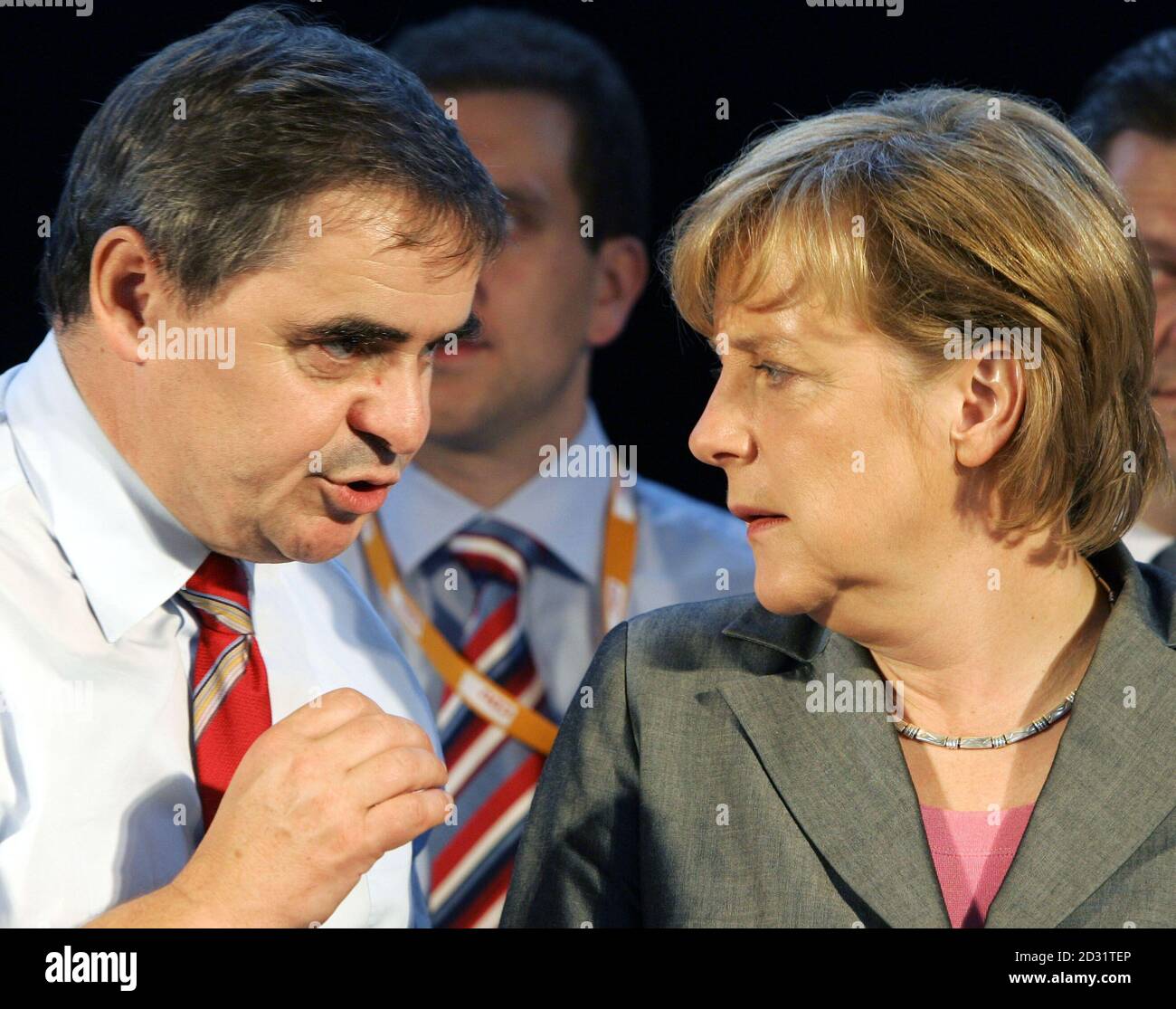 Angela Merkel, CDU's top candidate for the upcoming general elections, and  Saarland State Premier Mueller talk during campaign rally in Nohfelden.  Angela Merkel (R), Christian Democratic Union's (CDU) top candidate for the