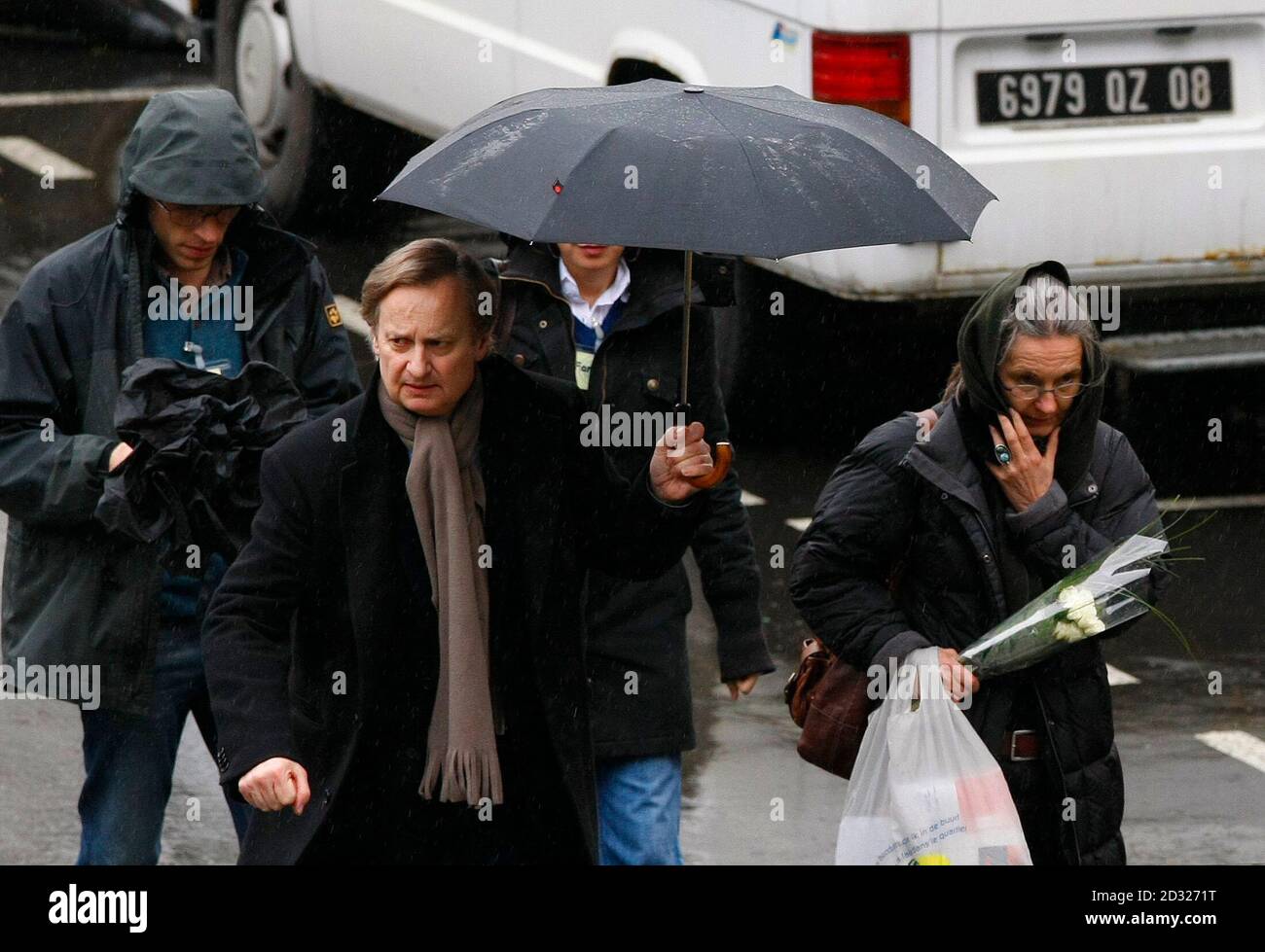 Belgian Marie-Noelle Bouzet (R), the mother of Elisabeth Brichet who was a  victim of the French self-confessed serial killer Michel Fourniret,  accompanied by her son Thomas (L) and her lawyer Jean-Maurice Arnould (