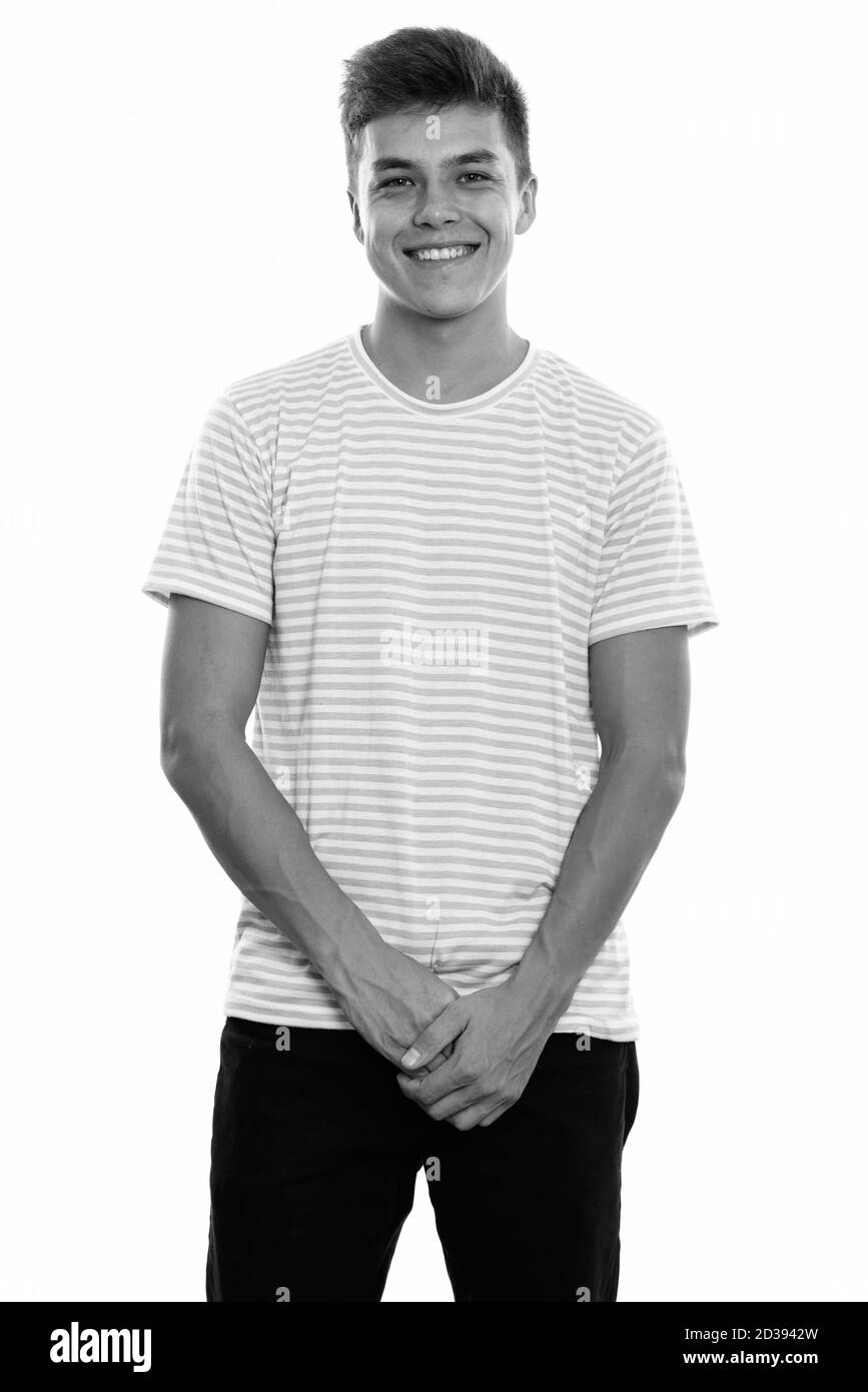 Studio shot of young man smiling Banque D'Images Studio shot of young man smiling Banque D'Images