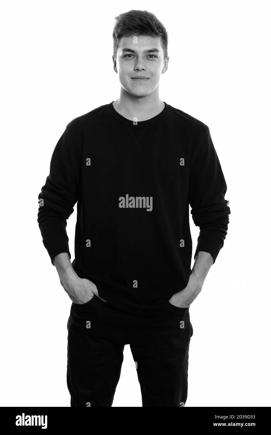 Studio shot of young handsome man standing Banque D'Images