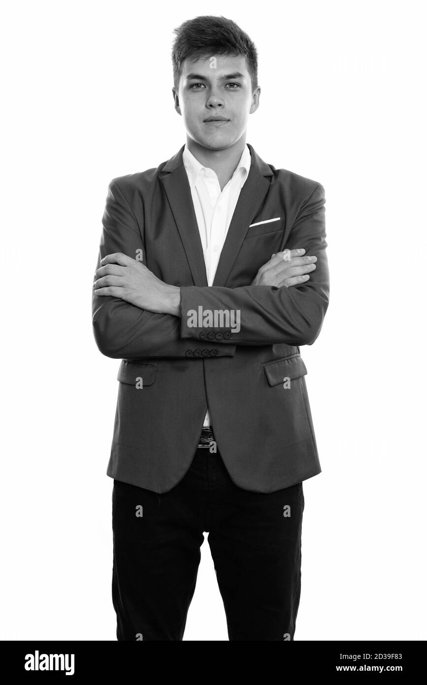 Studio shot of young man standing with arms crossed Banque D'Images Studio shot of young man standing with arms crossed Banque D'Images