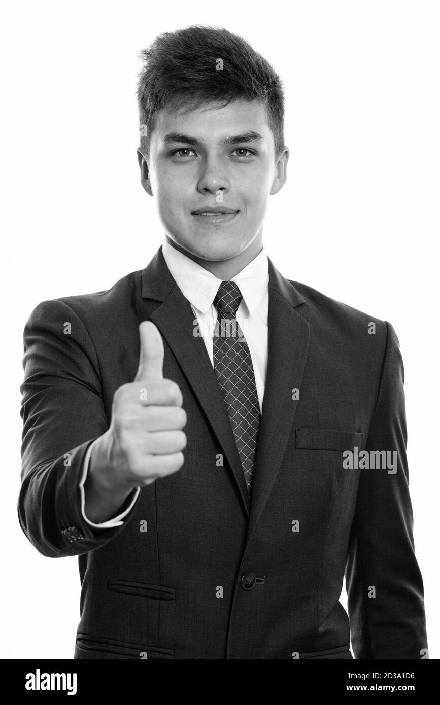 Studio shot of young handsome businessman giving thumb up Banque D'Images