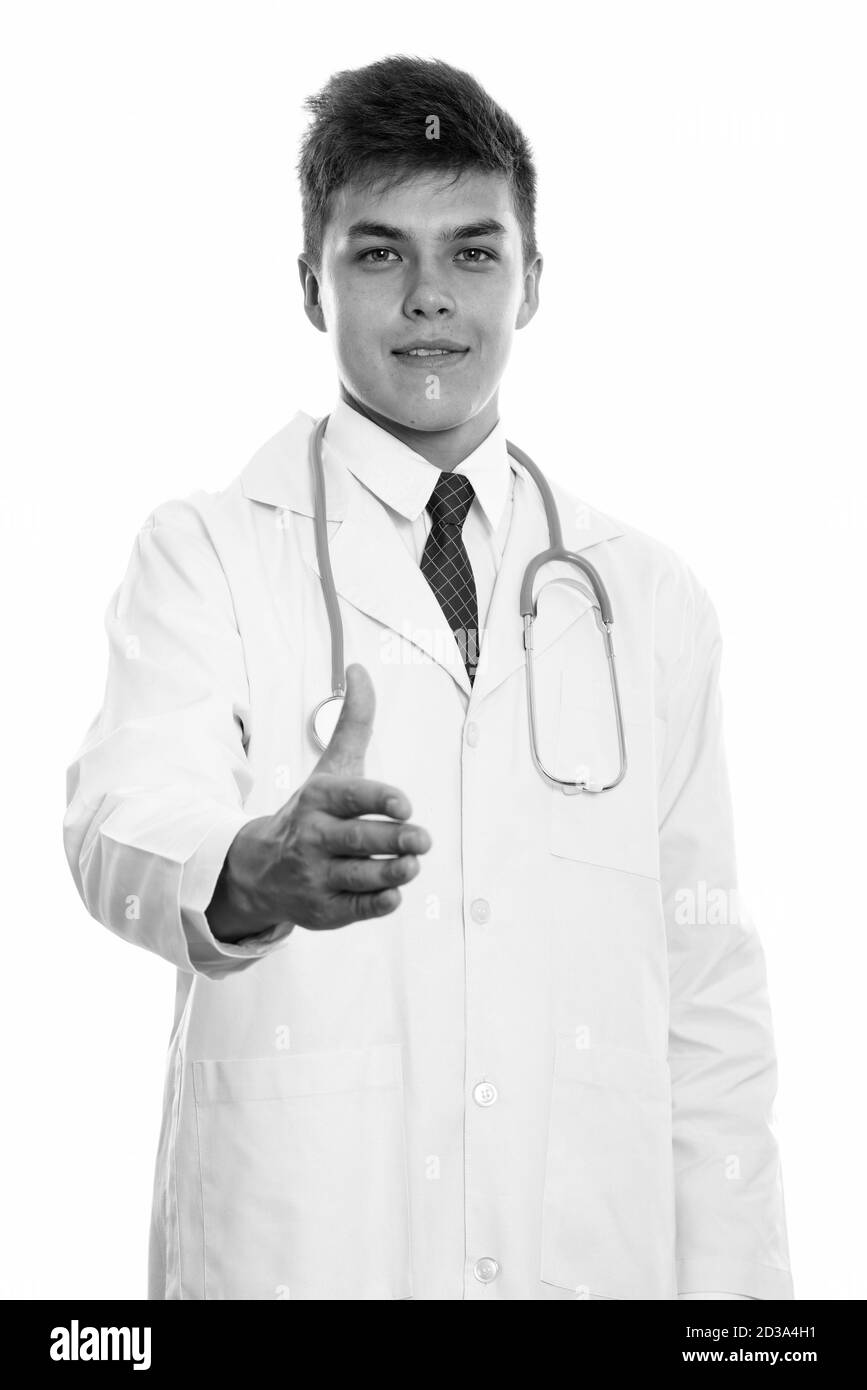 Portrait de jeune homme séduisant médecin donnant handshake Banque D'Images