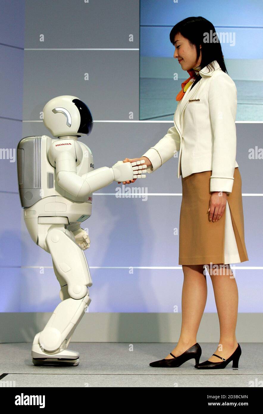 Honda Motor S Humanoid Robot Next Generation Asimo Steps In The Direction Being Pushed By A Model At Honda S Office In Wako North Of Tokyo December 15 04 Honda Motor Corp Announced The Development Of