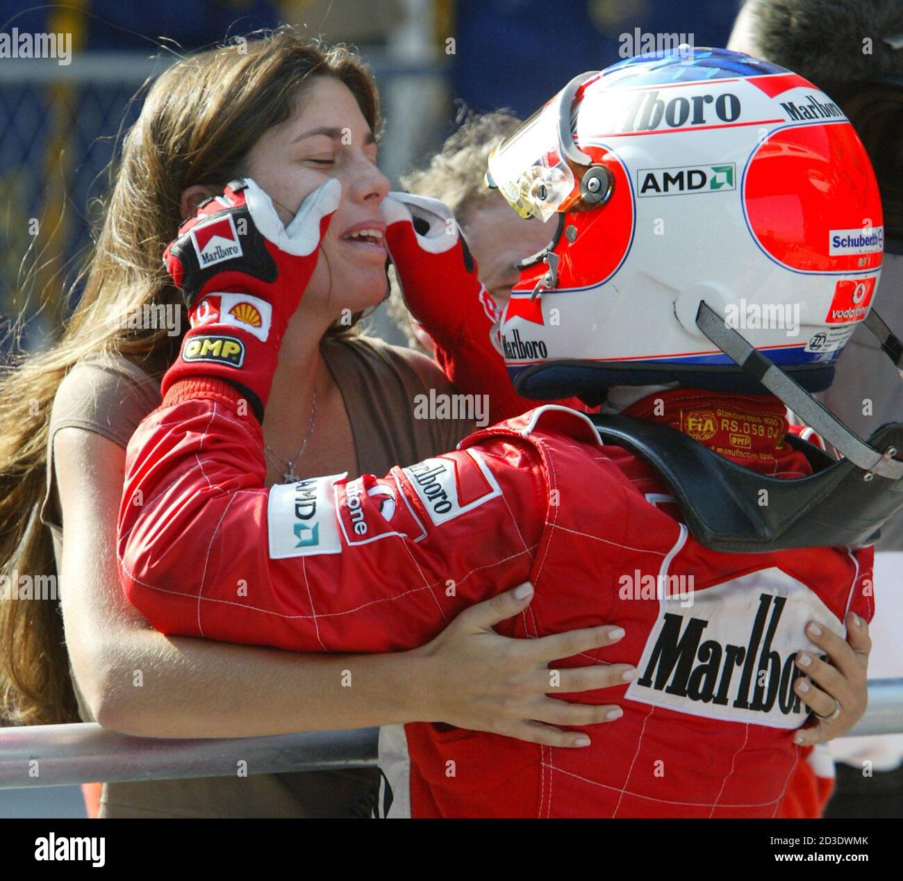 Brazilian Rubens Barrichello of Ferrari touches the face of his wife  Silvana after winning the inaugural Chinese Grand Prix. Brazilian Rubens  Barrichello of Ferrari touches the face of his wife Silvana after