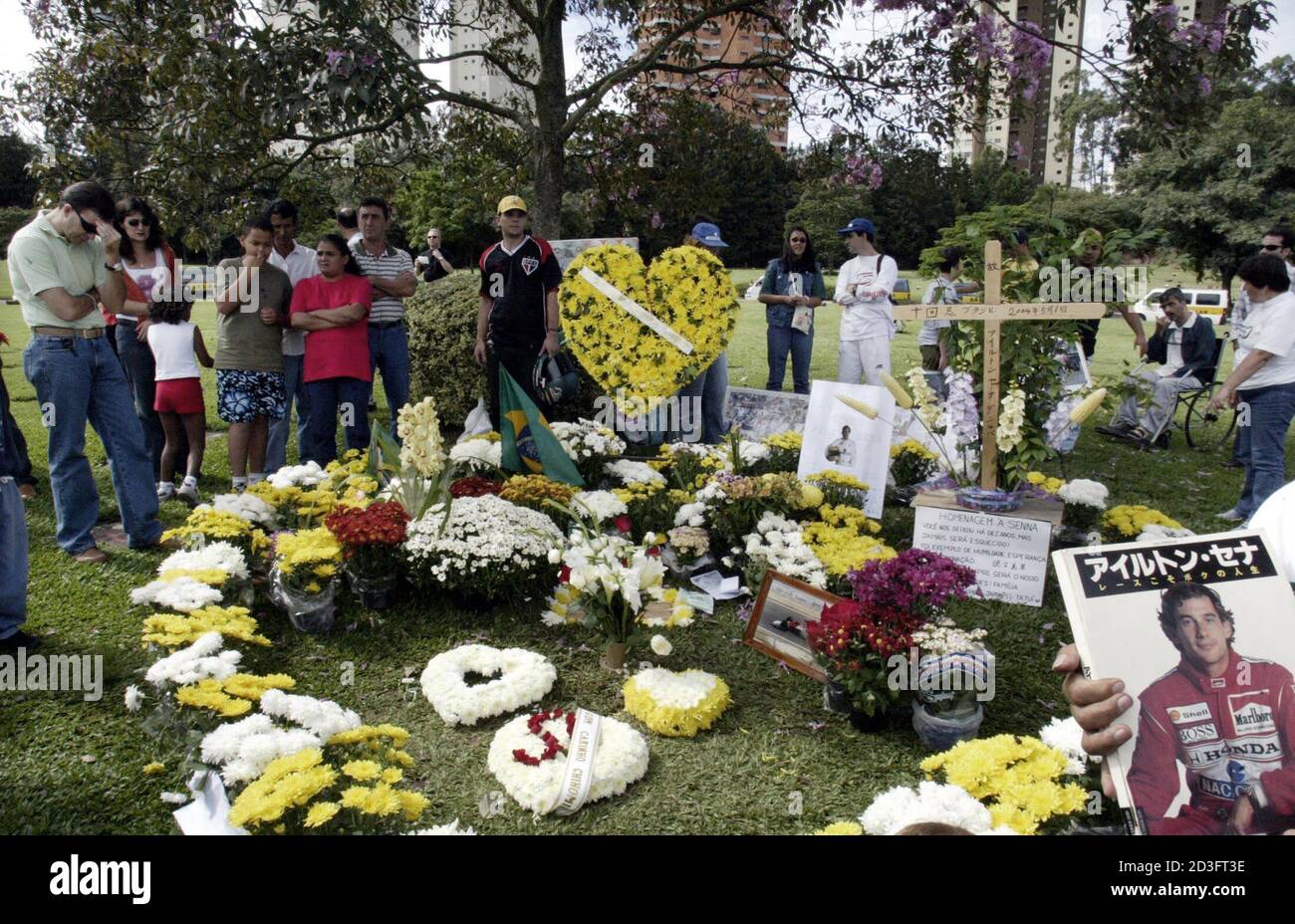 Fans Of Brazilian Formula One Driver Ayrton Senna Pray And Pay Tribute At His Grave Site In The Morumbi Cemetery In Sao Paulo May 1 04 Senna Died Ten Years Ago Following