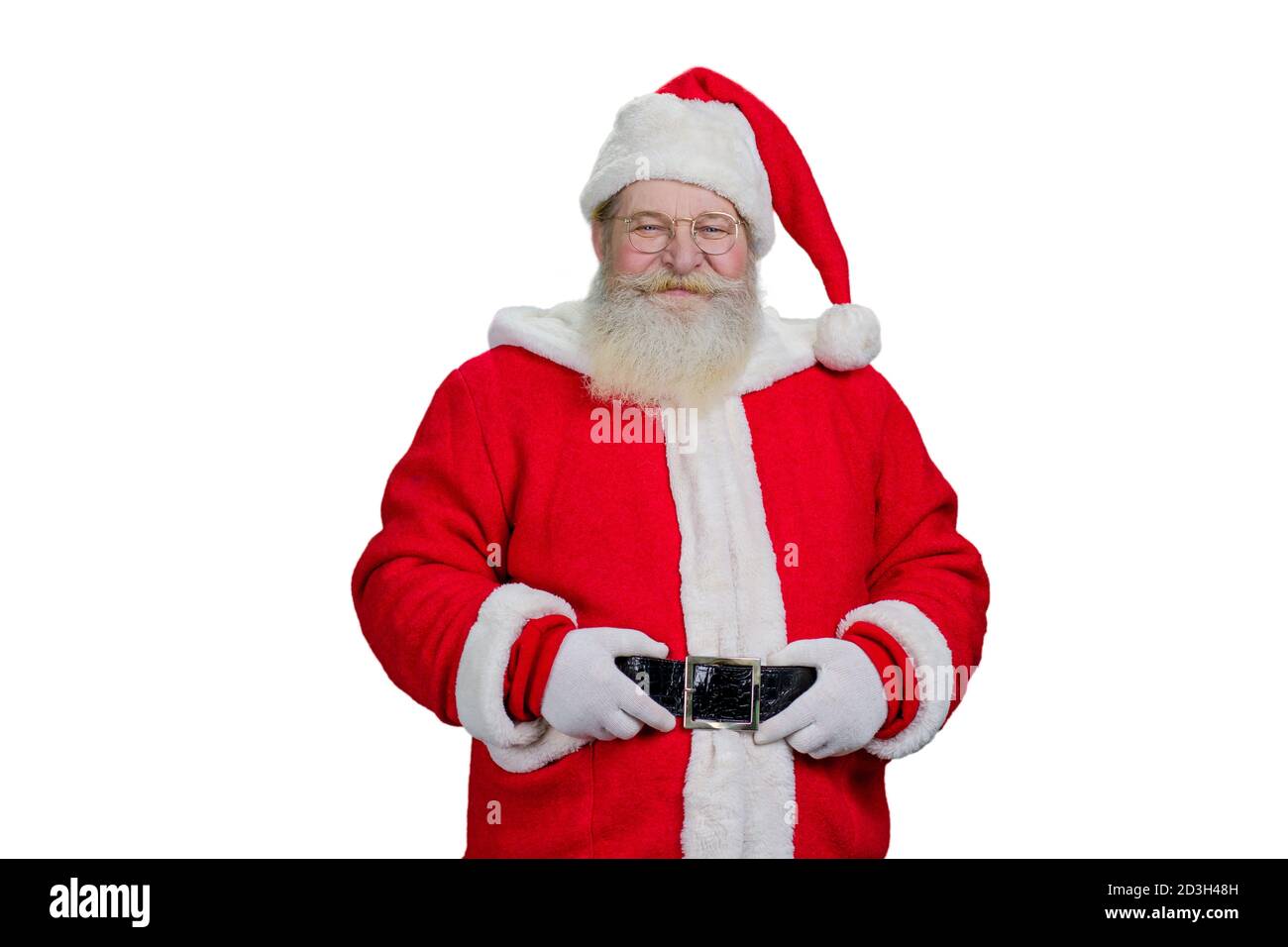 Le Père Noël tient sa ceinture. Banque D'Images