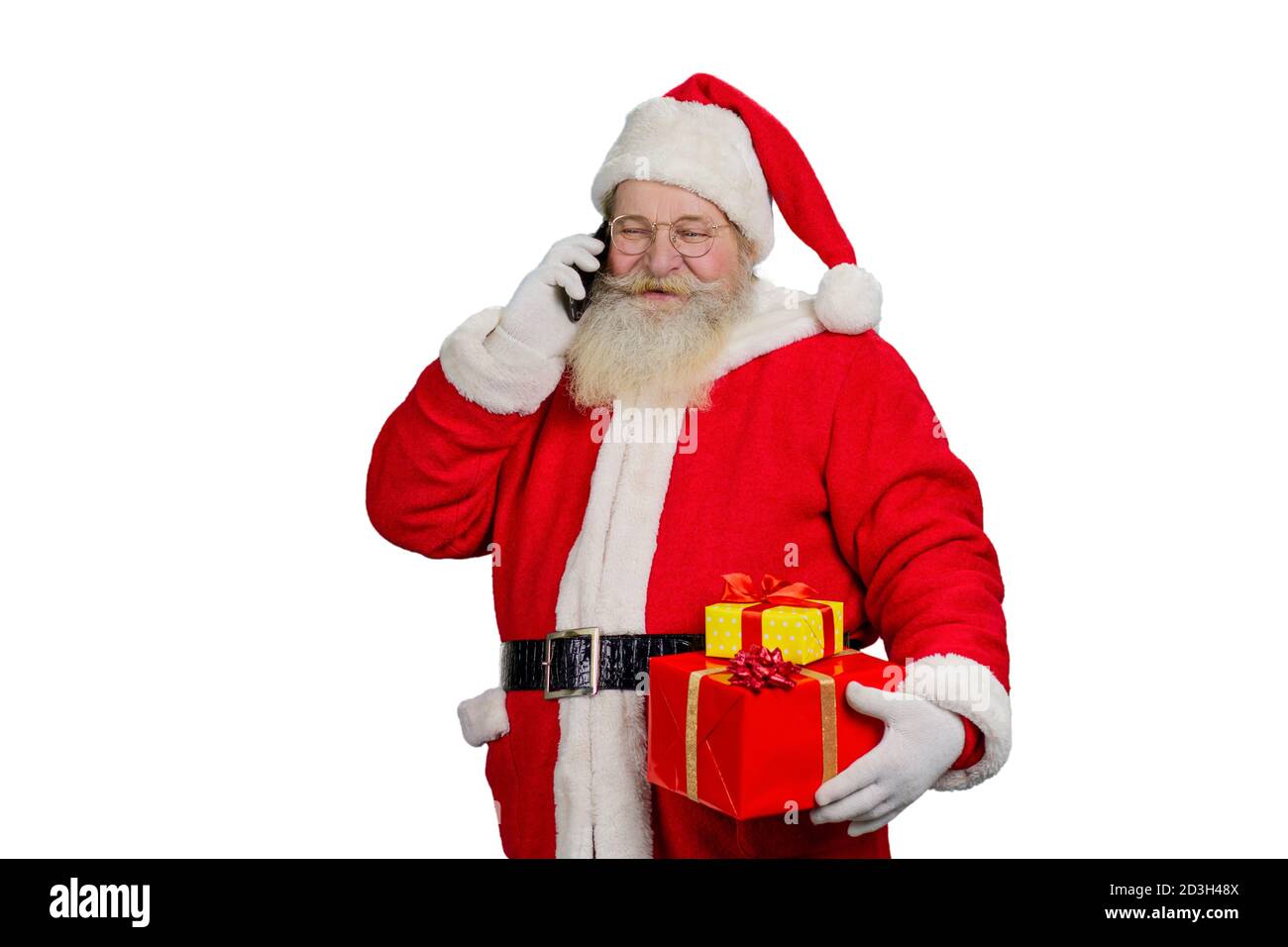 Le Père Noël parle au téléphone portable. Banque D'Images