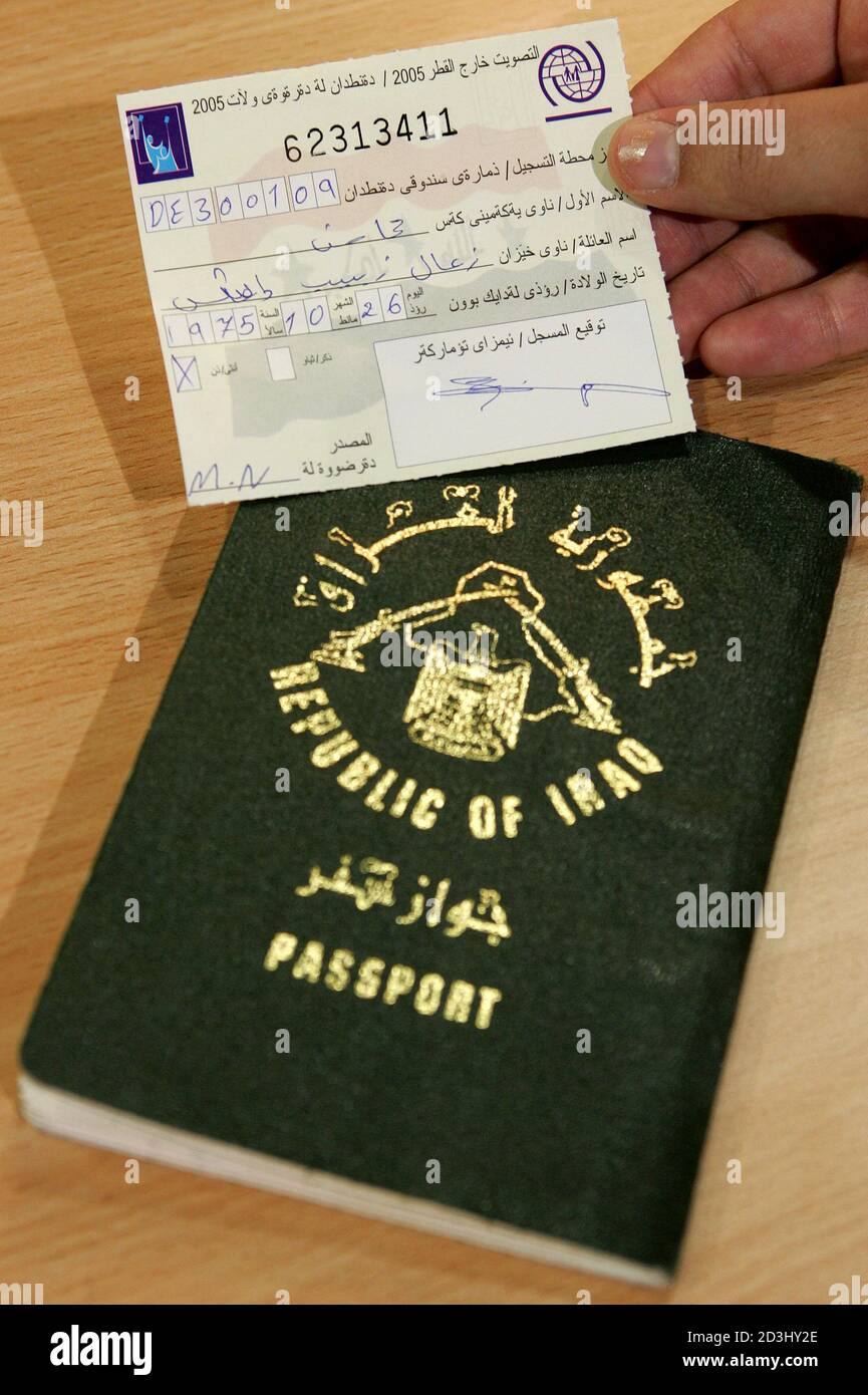 A Iraqi exile holds her personal voting paper next to her passport after  registering for the Iraq elections in Munich. A Iraqi exile holds her  personal voting paper next to her passport