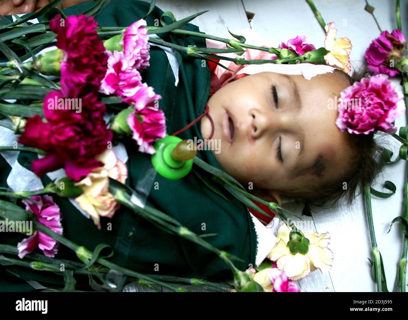 An 11 Month Palestinian Girl Killed Early Wednesday When Witnesses Said An Israeli Tank Shell Slammed Into Her Family S Hime In Rafah Refugee Camp In The Gaza Strip Lies Covered With Flowers