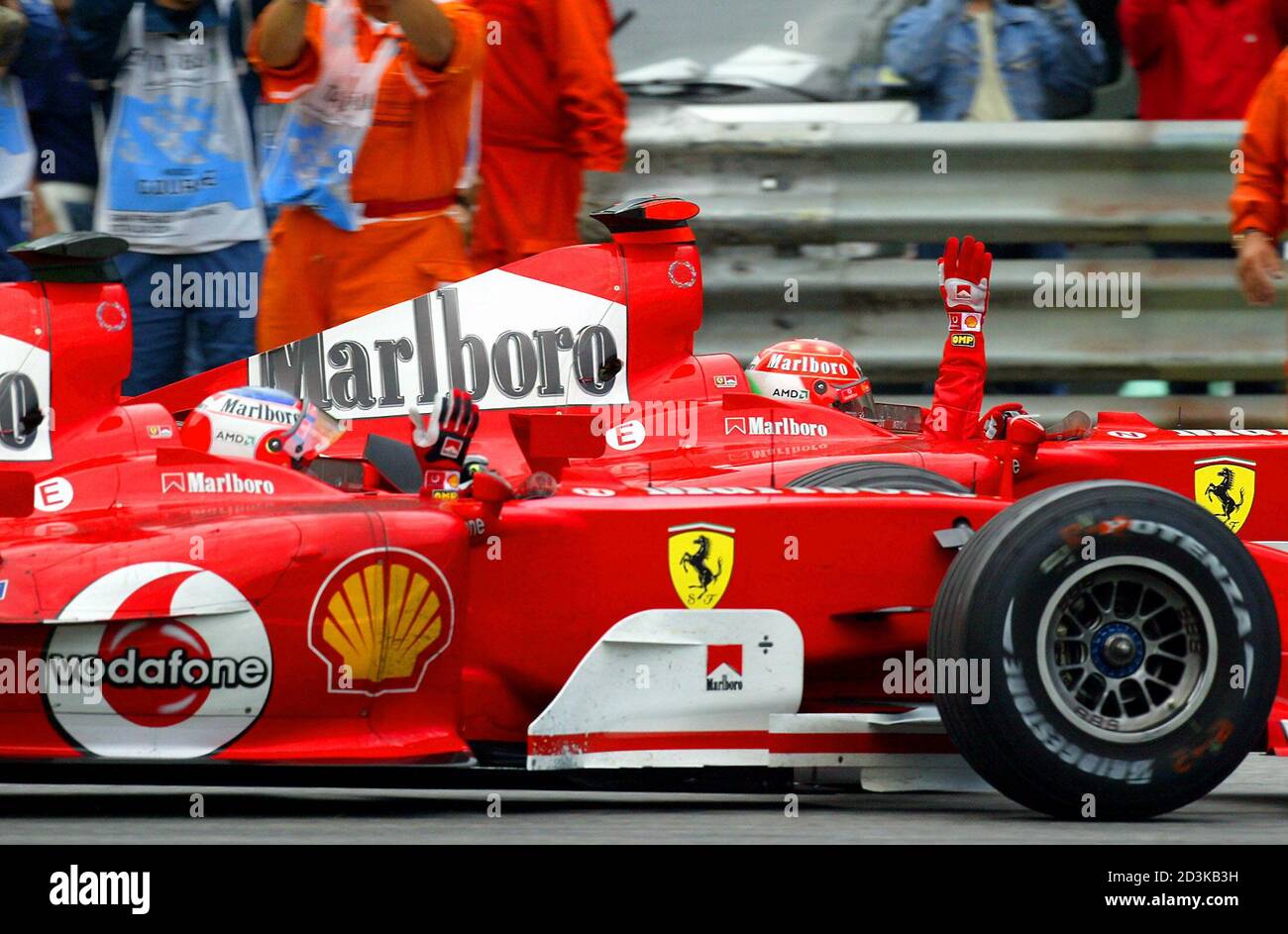 Ferrari Formula One World Champion Driver Michael Schumacher Of Germany R And His Team Mate Brazilian Driver Rubens Barrichello Celebrate At The End Of The Italian Italian Grand Prix At The Monza