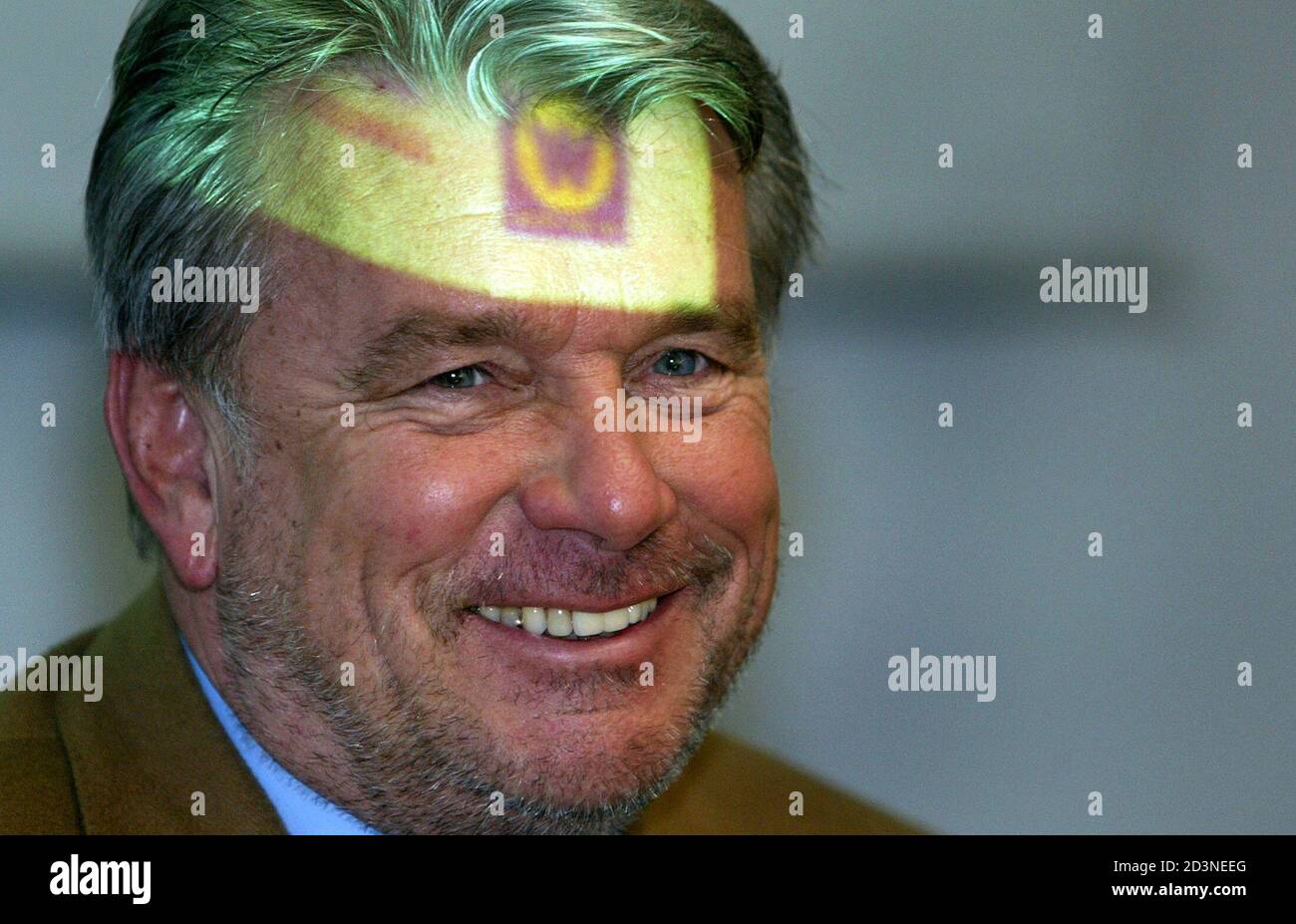 Strabag CEO Haselsteiner has a logo of Walter Bau AG projected on to his  forehead during a news conference in Augsburg. Chief Executive Officer  (CEO) Hans Peter Haselsteiner of the Austrian building