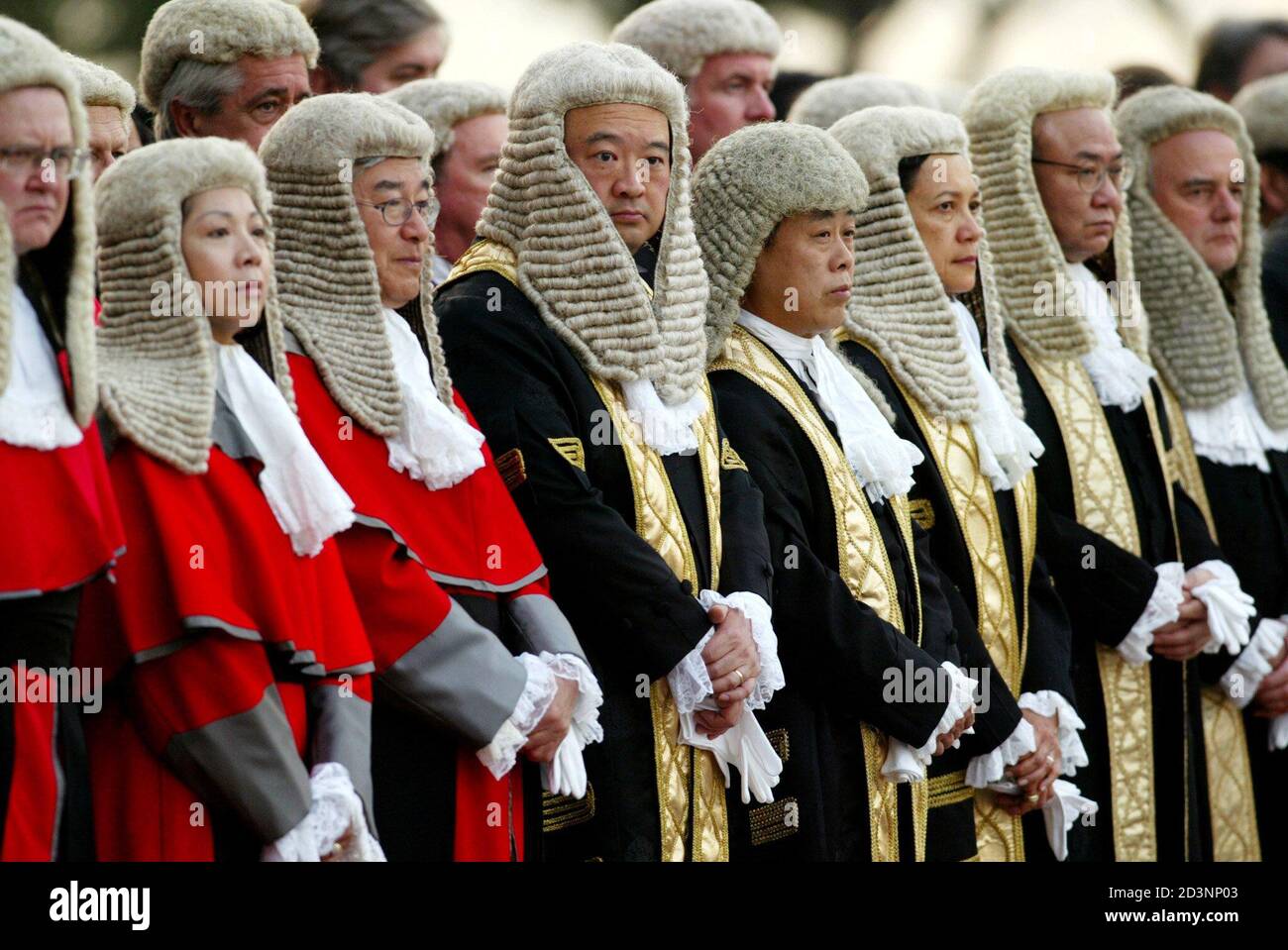 Local and expatriate supreme court judges wearing wigs attend a ceremony to  mark the beginning of the new legal year in Hong Kong January 13, 2003.  Anxiety over a planned but controversial