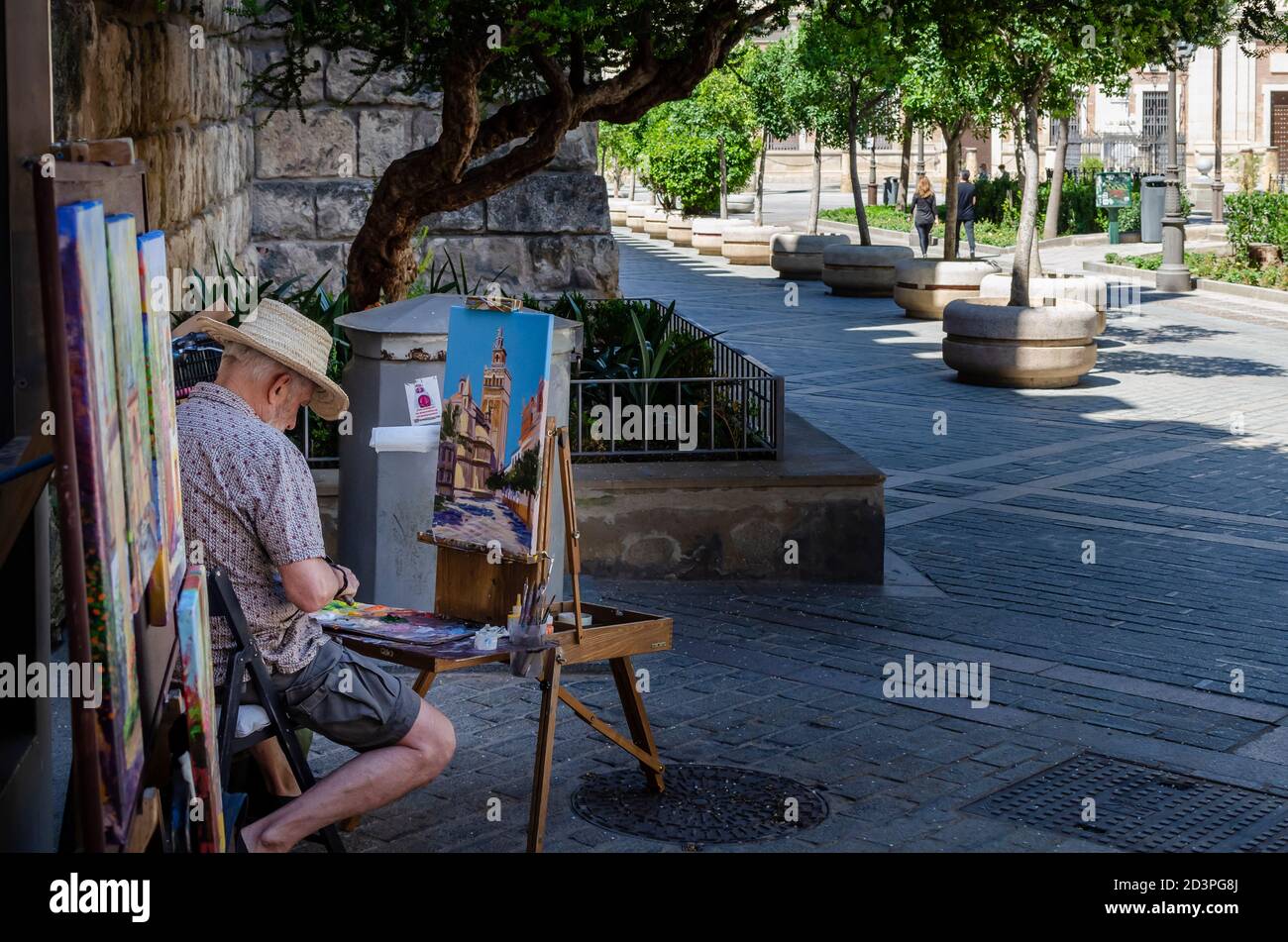 Peintre de rue travaillant dans la rue Banque D'Images