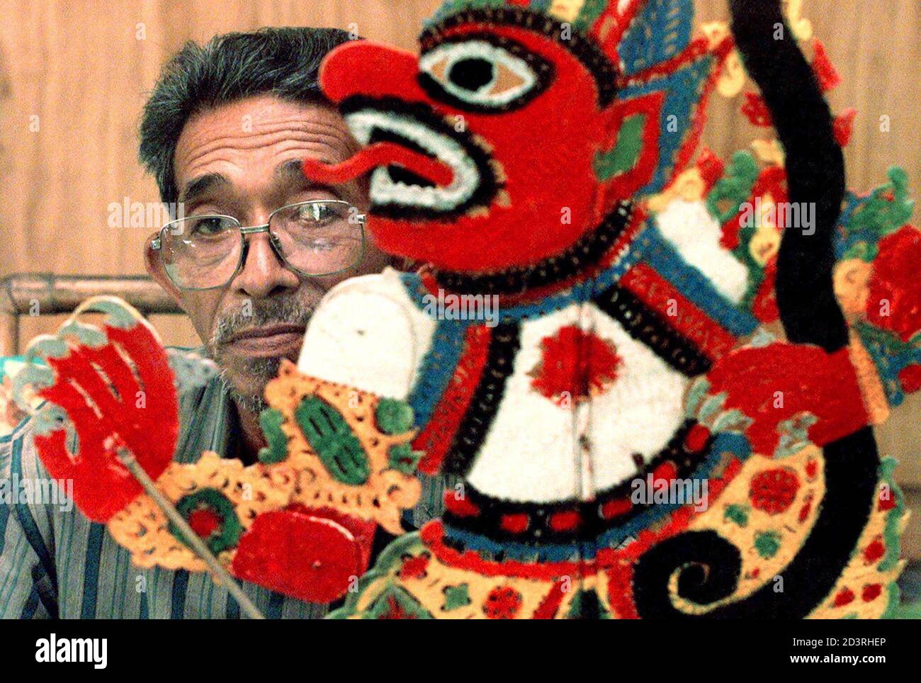 Kelantanese Malaysian Abdullah Ibrahim Known As Pak Uncle Dollah Shows His Wayang Kulit Or Leather Shadow Puppet In Ketereh A Small Town In The Northern State Of Kelantan February 23 2001 Wayang