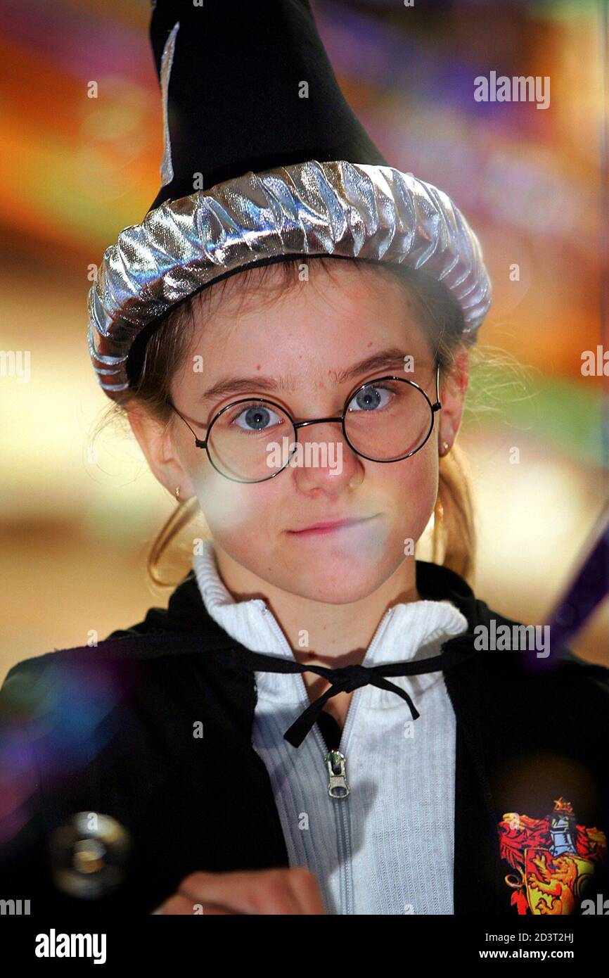 A girl dressed as a Harry Potter character waits in line at a book store in  Sydney for her pre-purchased copy of the new book "Harry Potter and the  Half-Blood Prince" July