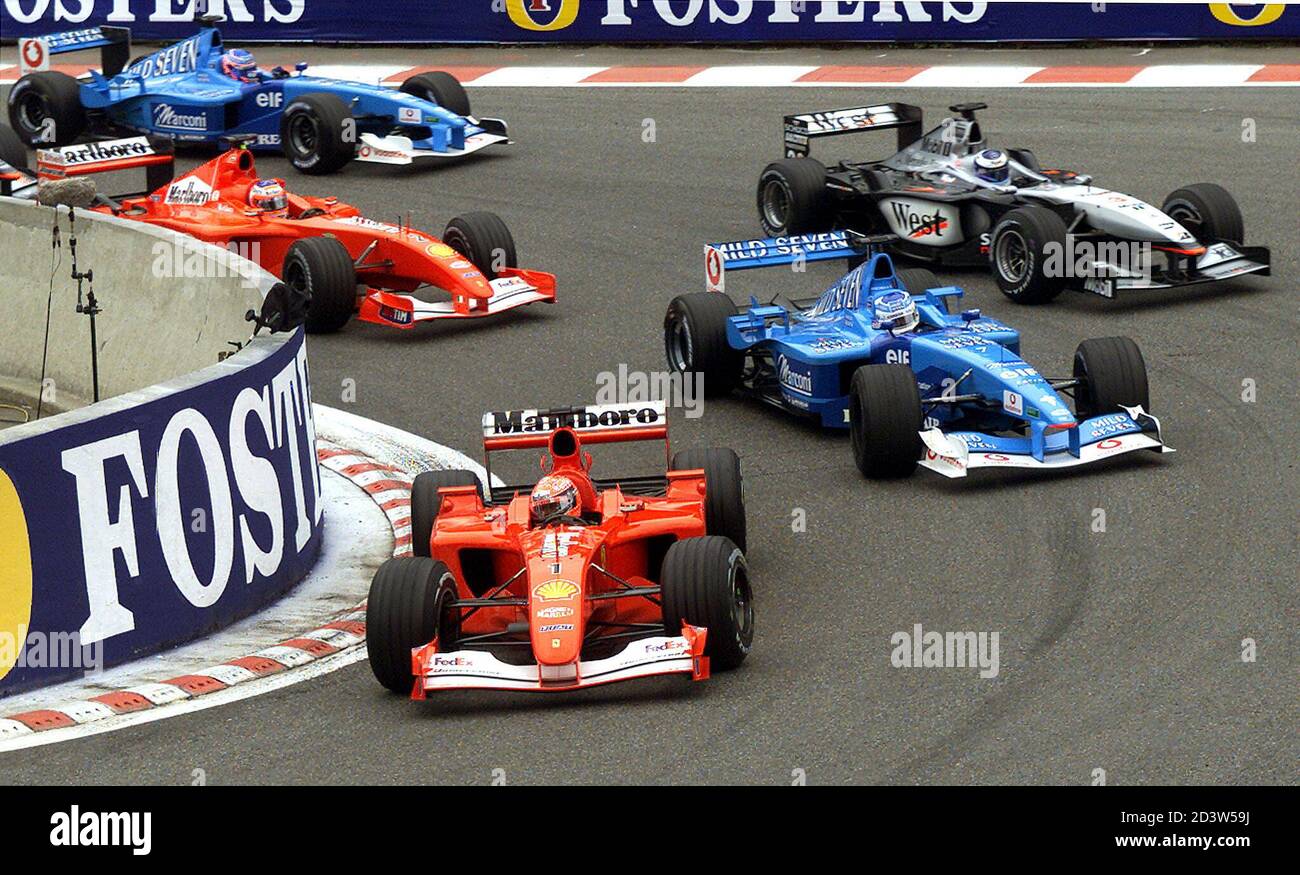 Germany's Ferrari driver Michael Shumacher (C) leads the race before  Italy's Benetton Renault Giancarlo Fisichella (R) Scotland's McLaren  Mercedes driver David Coulthard (2ndR), Brazil's Ferrari driver Rubbens  Barrichello (L) and British Benetton