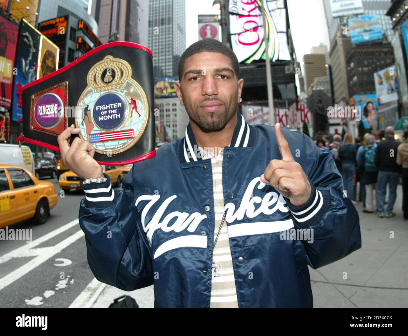 Boxer Ronald "Winky" Wright poses in a New York Yankees baseball jacket at  Times Square in New York, May 26, 2005. Wright, boxing's undisputed  middleweight champion, defeated Felix Trinidad last week by