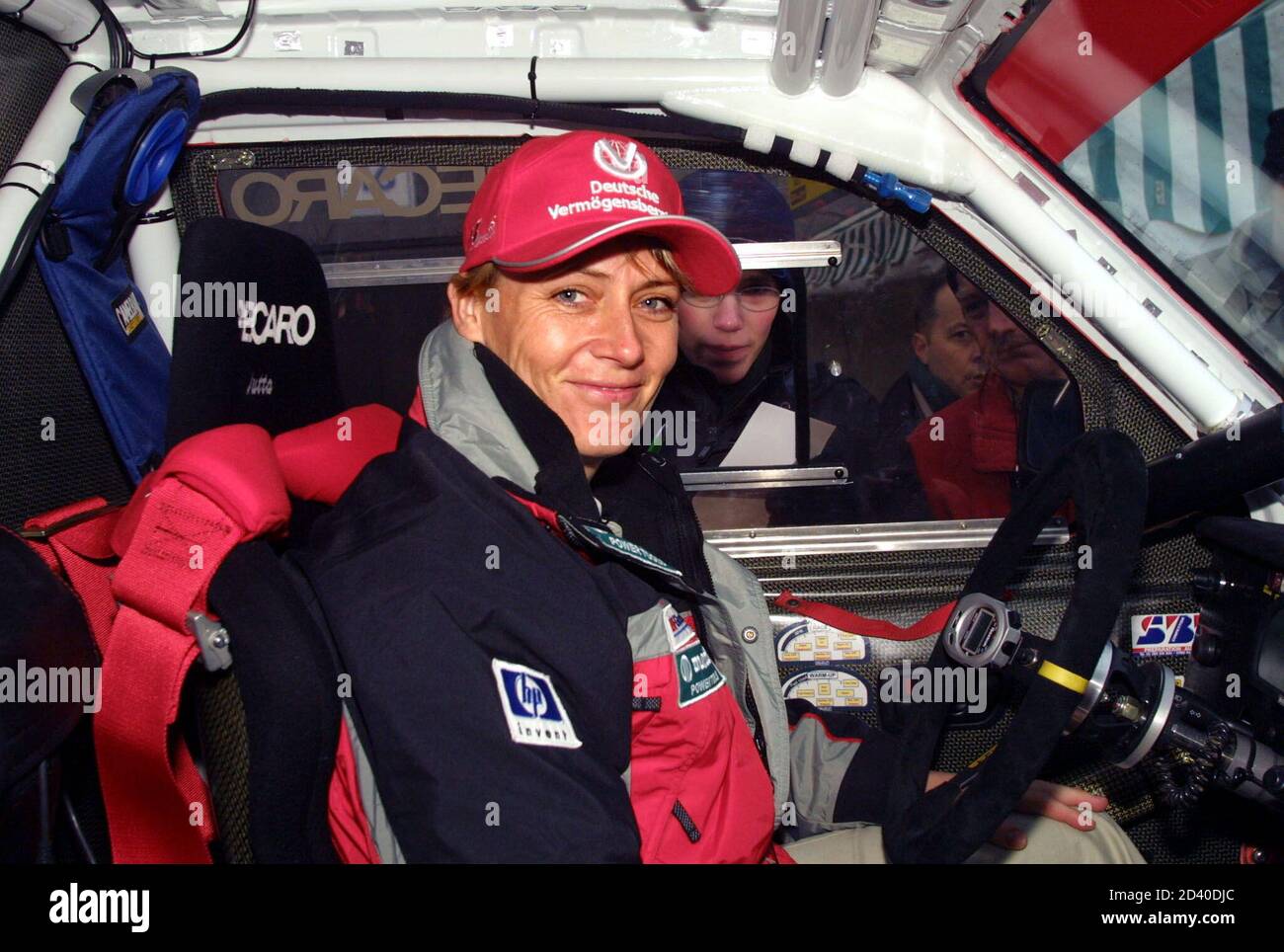 German driver Jutta Kleinschmidt drives her car at the Paris-Dakar rally  technical check on the eve of the race start in Arras, Northern France  December 27, 2001. [The Dakar rally, one of