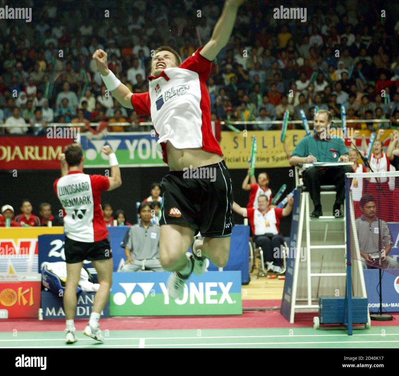 DENMARK JENS ERIKSEN AND MARTIN LUNDGAARD DURING THE SEMIFINAL MATCH OF THE  DOUBLE MAN THOMAS CUP IN JAKARTA. Danish player Jens Eriksen jump while his  partner Martin Lundgaard punches the air after
