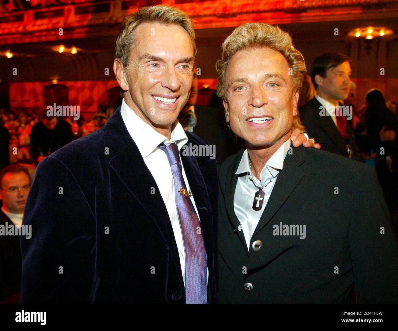 German fashion designer Wolfgang Joop (L) and German illusionist Siegfried  Fischbacher pose before the World Awards gala in the northern German city  of Hamburg October 22, 2003. Fischbacher received the "World Entertainment