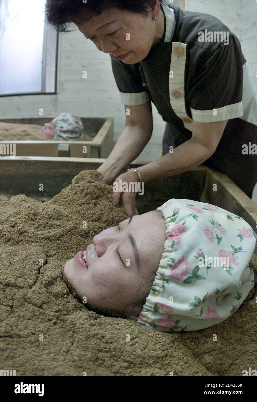 A Japanese Woman Takes A Deep Breath As She Perspires In A Popular Koso Buro Enzyme Bath Made From A Mixture Of Japanese Cypress Sawdust Rice Bran And 60 Different Fruit And Vegetable