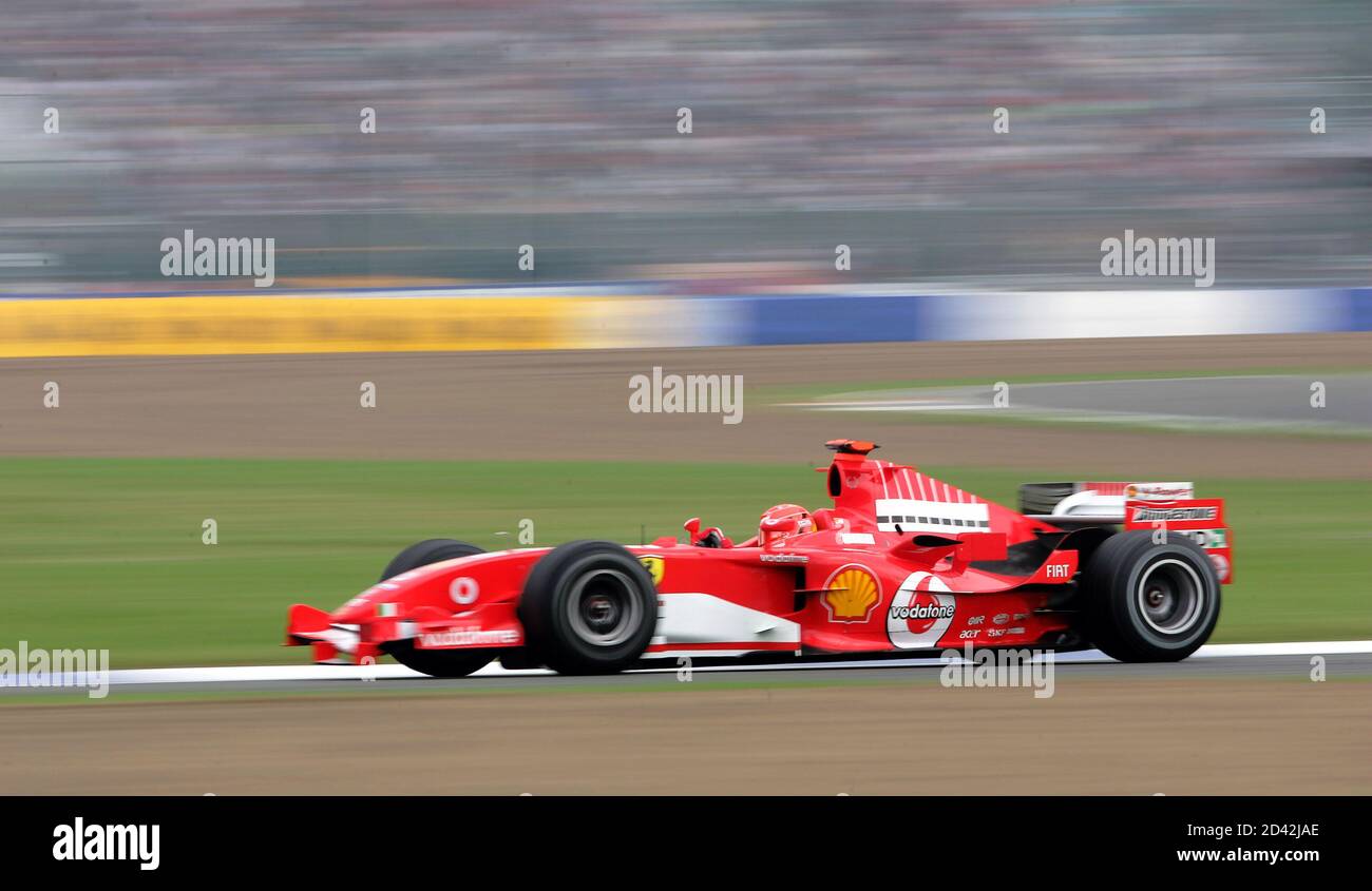 Ferrari Formula One driver Schumacher of Germany goes through Luffield turn  during practice for British Grand Prix at Silverstone. Ferrari Formula One  driver Michael Schumacher of Germany goes through the Luffield turn