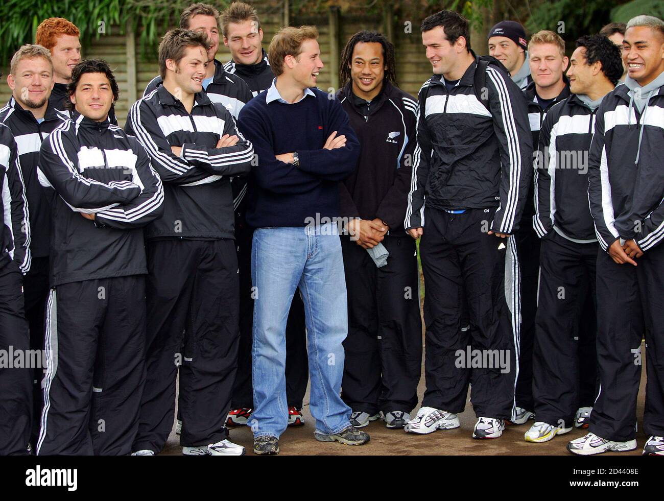 Britain's Prince William laughs with members of the All Blacks at a public  training session in Auckland. Britain's Prince William (front 3rd L) laughs  with members of the All Blacks at a