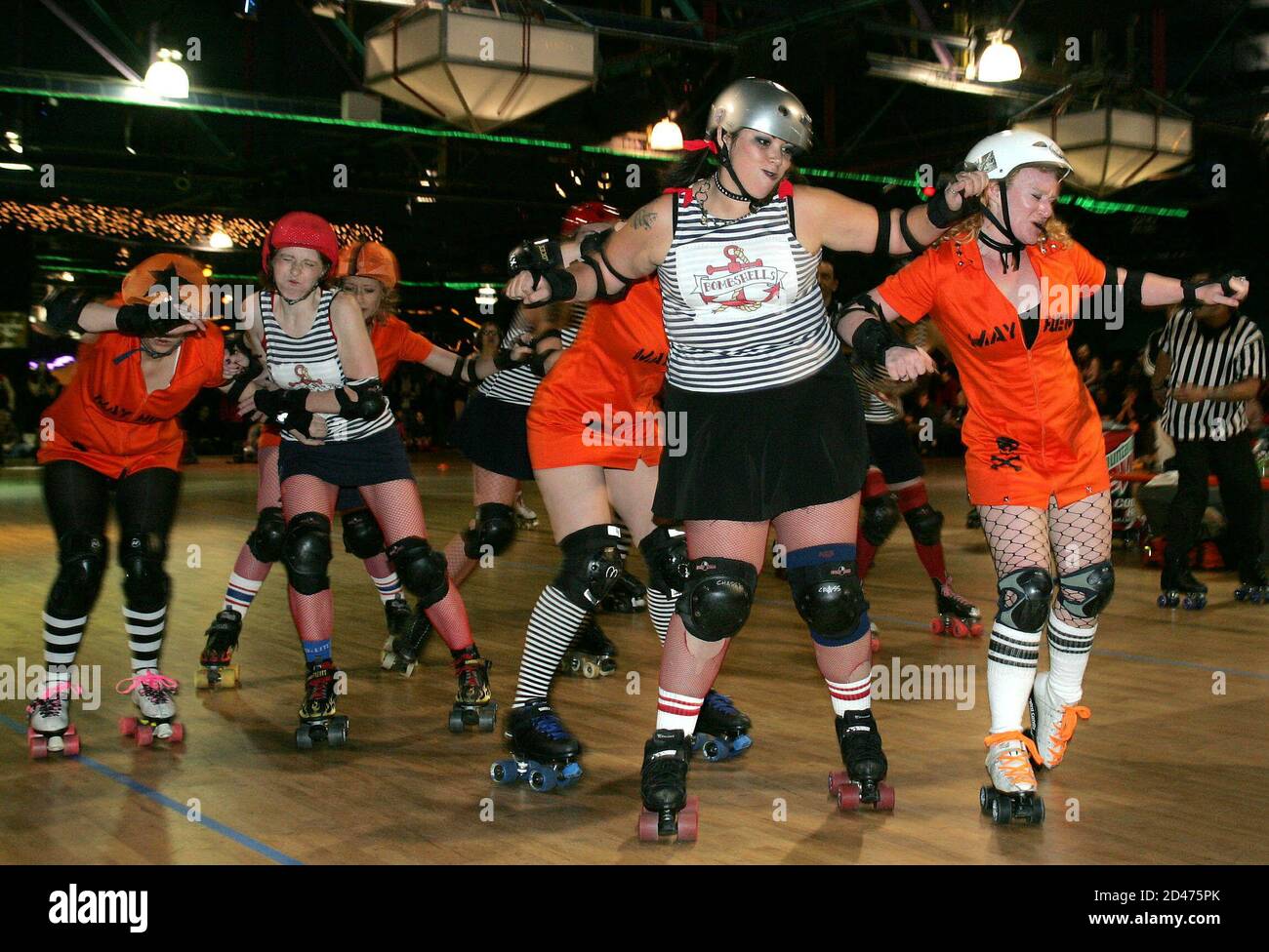 Brooklyn Bombers co-captain Chassis Crash (L) clashes with Manhattan Mayhem  team captain Ginger Snap during the first ever Gotham Girls Roller Derby  exhibition bout between the Mayhem and the Brooklyn Bombshells at