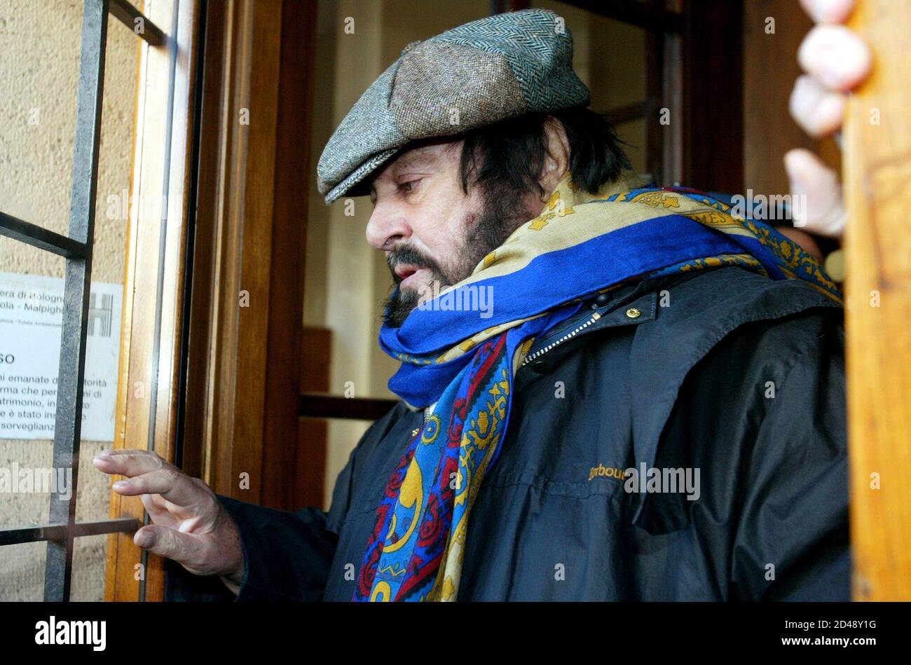Italian opera star Luciano Pavarotti gets out of car upon his arrival at  Saint Orsola hospital in Bologna, northern Italy, January 15, 2003.  [Nicoletta Mantovani, Pavarotti's partner, has given birth to a