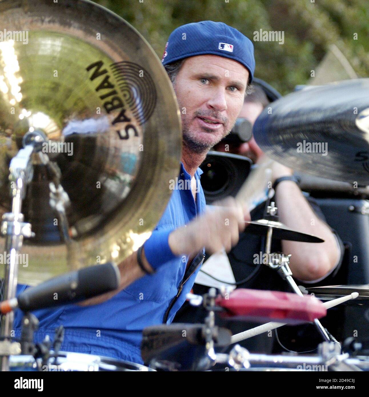 Red Hot Chili Peppers" drummer Chad Smith performs on a stage set up at an  apartment complex pool in Las Vegas, Nevada, August 3, 2002 as part of  VH1's "Backyard Barbecue" contest. [