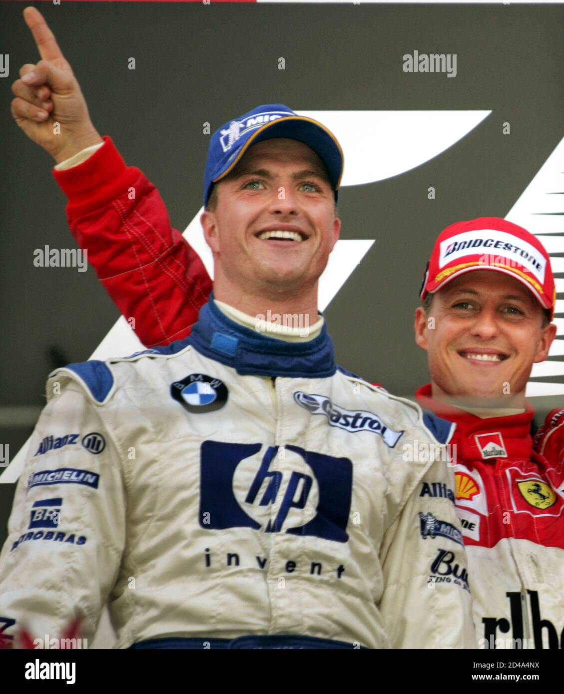 Germany S Ralf Schumacher L And His Brother Michael Of Ferrari Celebrate Atop The Podium During The Victory Ceremony For The Japanese Grand Prix In Suzuka Central Japan October 10 04 Ralf Earned