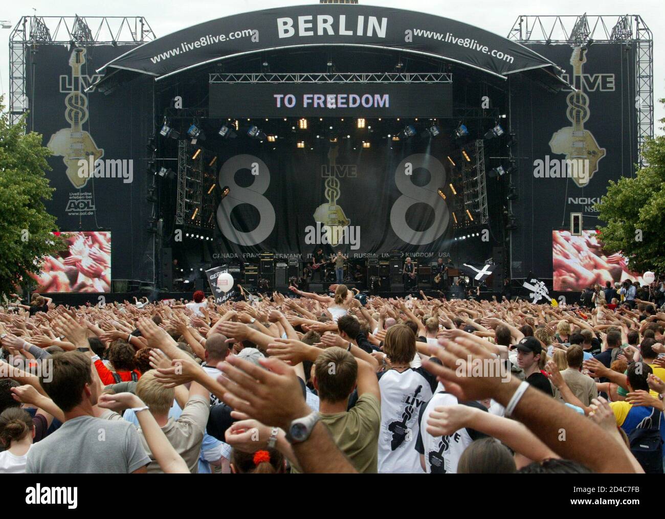 German band 'Die Toten Hosen' performs during the Live 8 concert in front  of the Victory column in Berlin, July 2, 2005. A galaxy of rock and roll  stars will grace stages