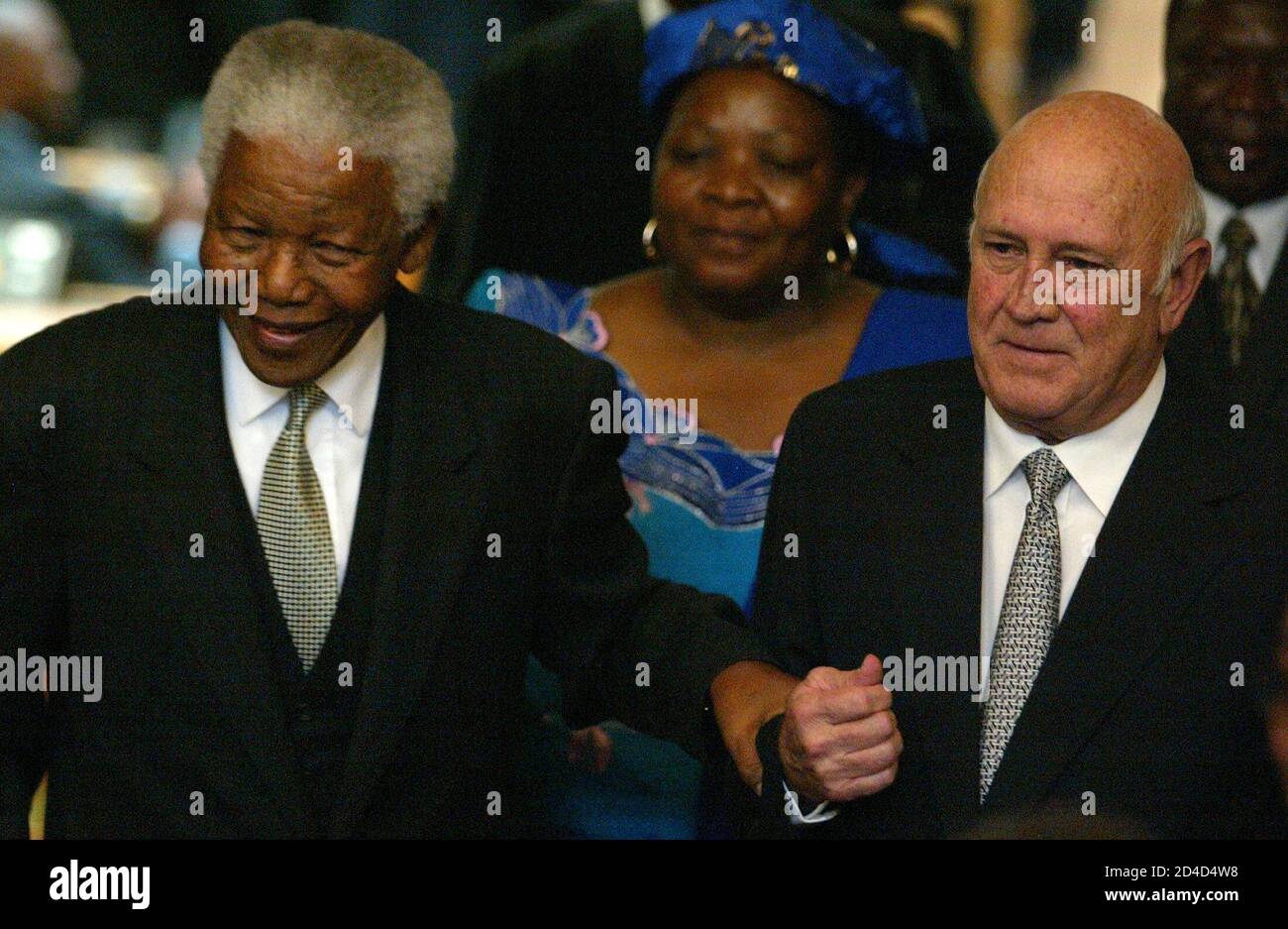 Former South African Presidents Nelson Mandela and FW de Klerk leave the  country's Parliament in Cape Town, May 10, 2004. Mandela and FW de Klerk  addressed a special joint sitting of Parliament
