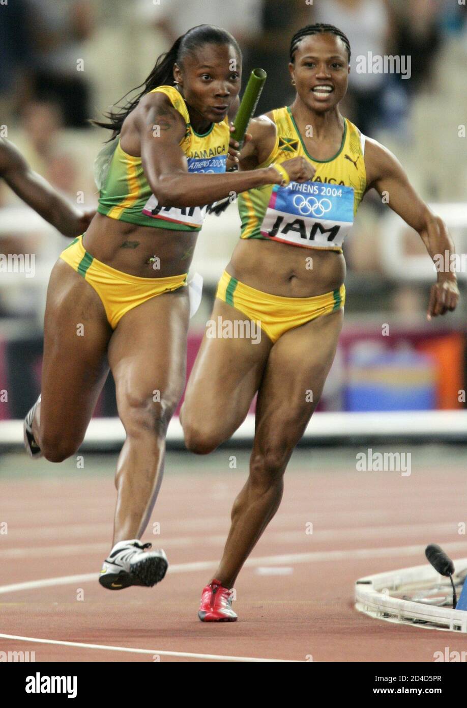Jamaica's Beverly McDonald passes the baton to team mate Aleen Bailey  during a heat of the women's 4 x 100 metres relay at the Athens 2004  Olympic Games. Jamaica's Beverly McDonald (R)
