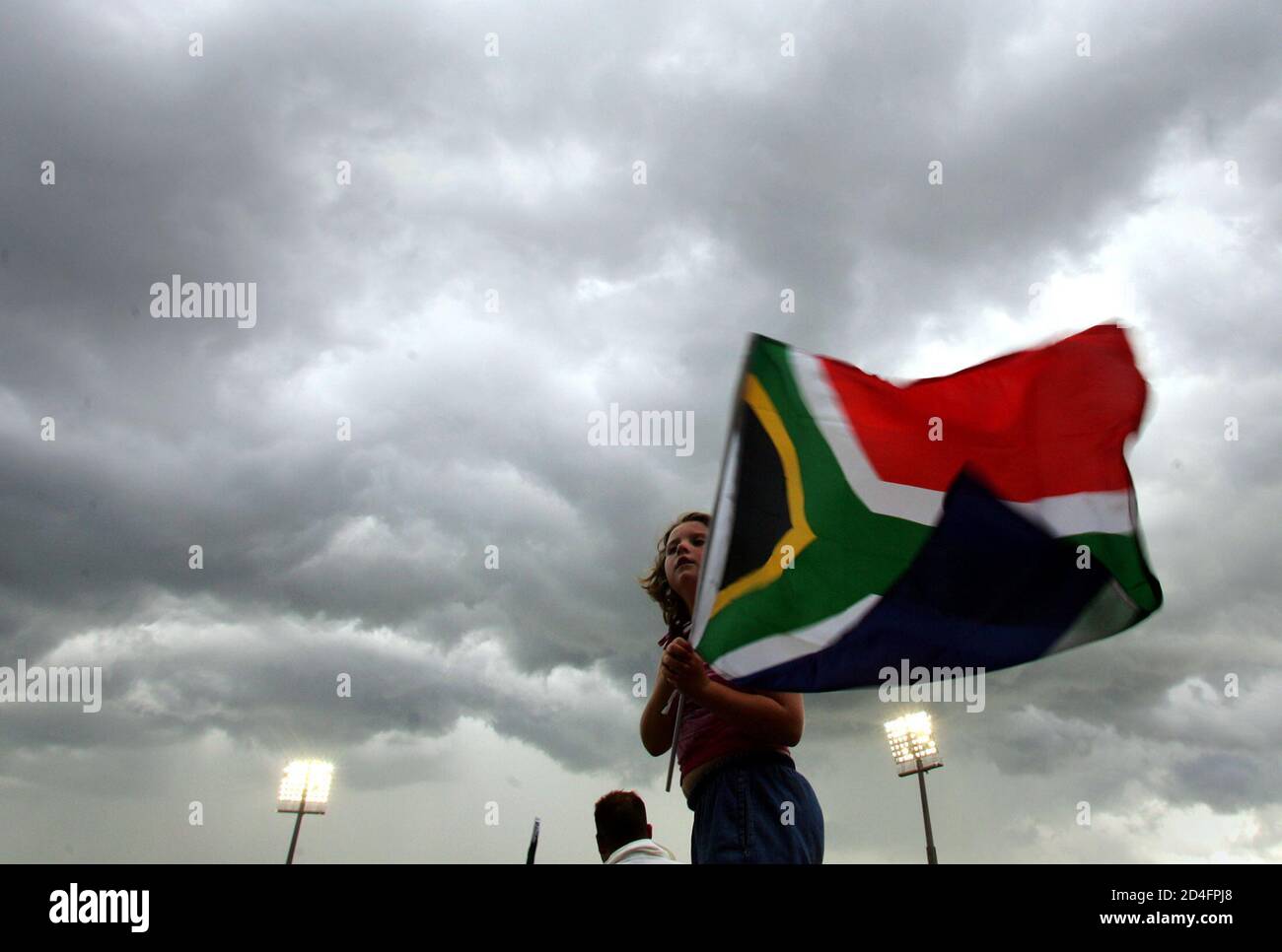 A Young South African Cricket Fan Waves Her Flag As Thunderclouds Bring An End To Play On The Second Day Of The Fifth Test Match Between England And South Africa A Young