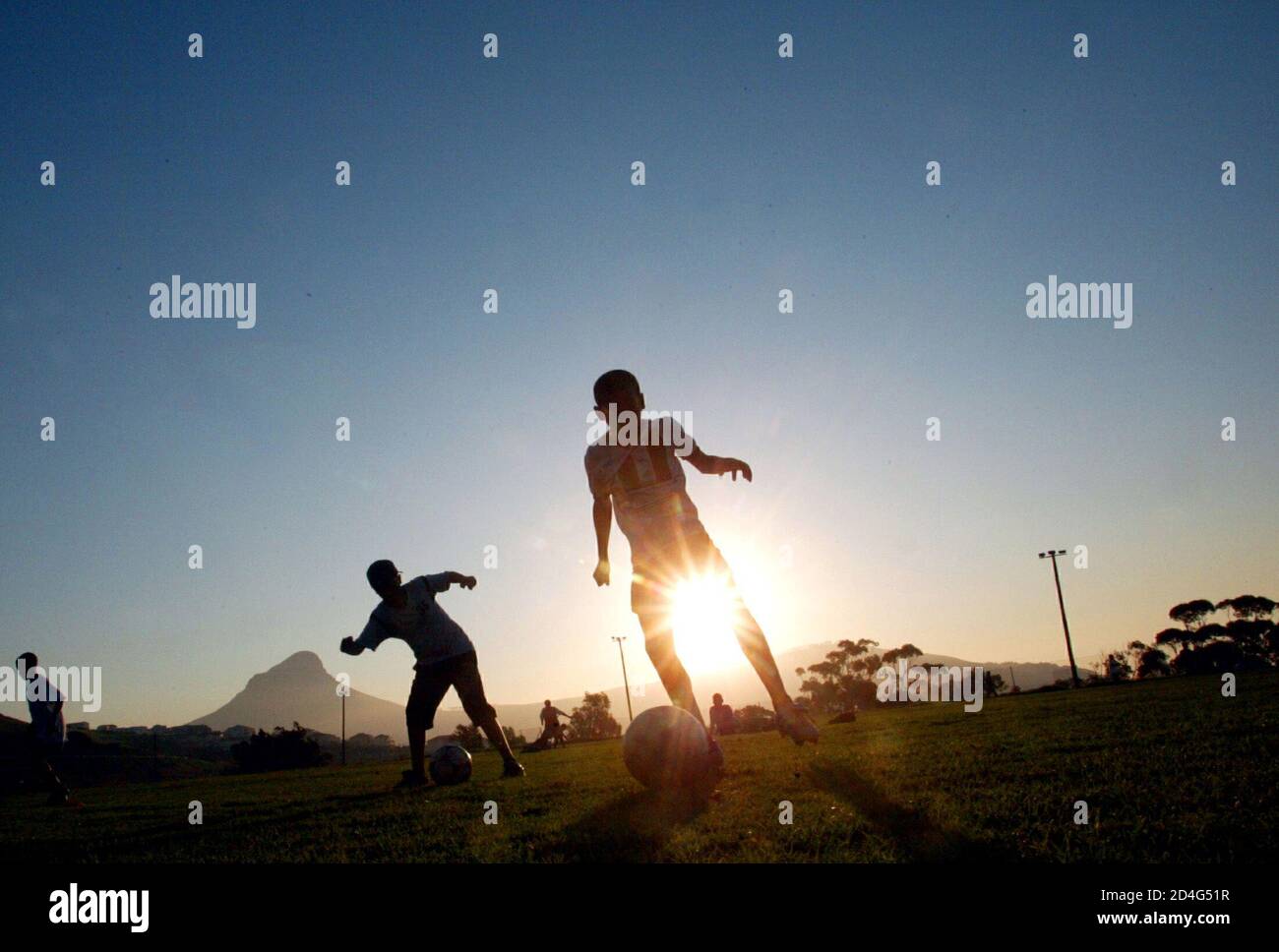 Aspiring soccer stars train in Cape Town, May 8, 2004. For thousands of  young players accross the country, [their dream is to be part of the  national team "Bafana Bafana" at the