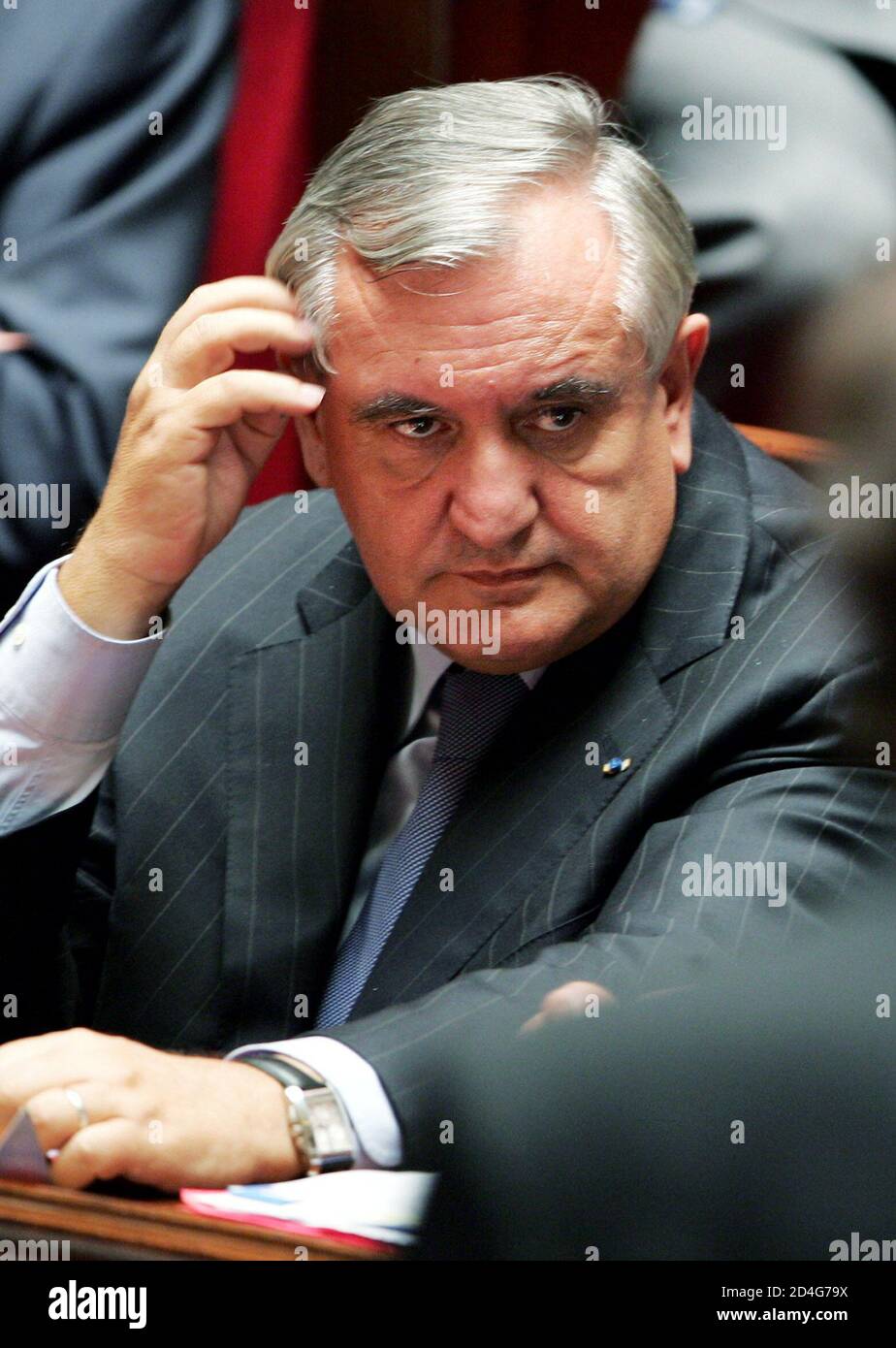 French Prime Minister Jean-Pierre Raffarin sits during the opening session  of parliament at the National Assembly in Paris, October 5, 2004. [Raffarin  defended the government's efforts to free two French journalists held