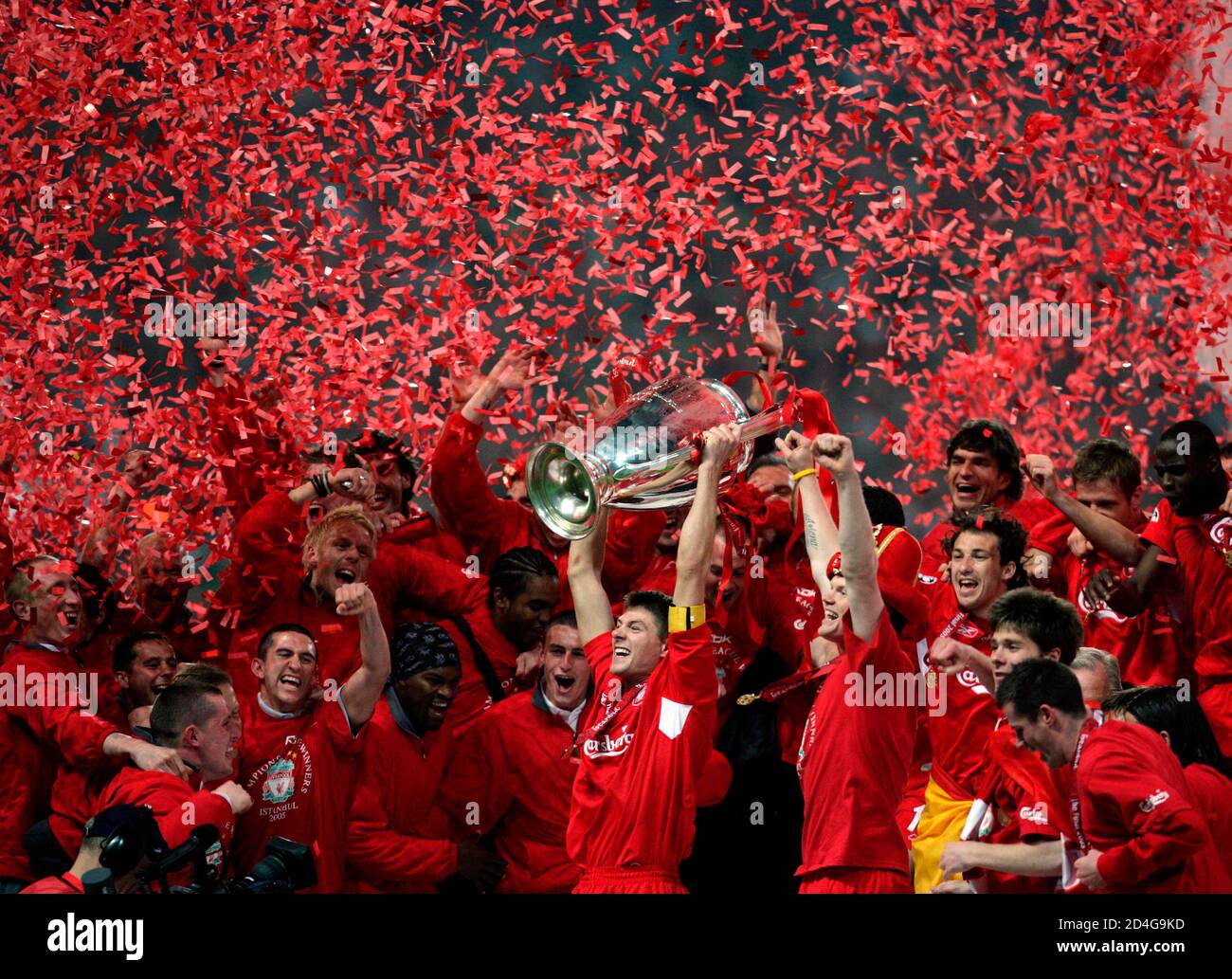 Liverpool S Captain Steven Gerrard Holds The Trophy In Front Of His Team Mates Covered By Confetti In Istanbul Liverpool S Captain Steven Gerrard Holds The Trophy In Front Of His Team Mates Covered