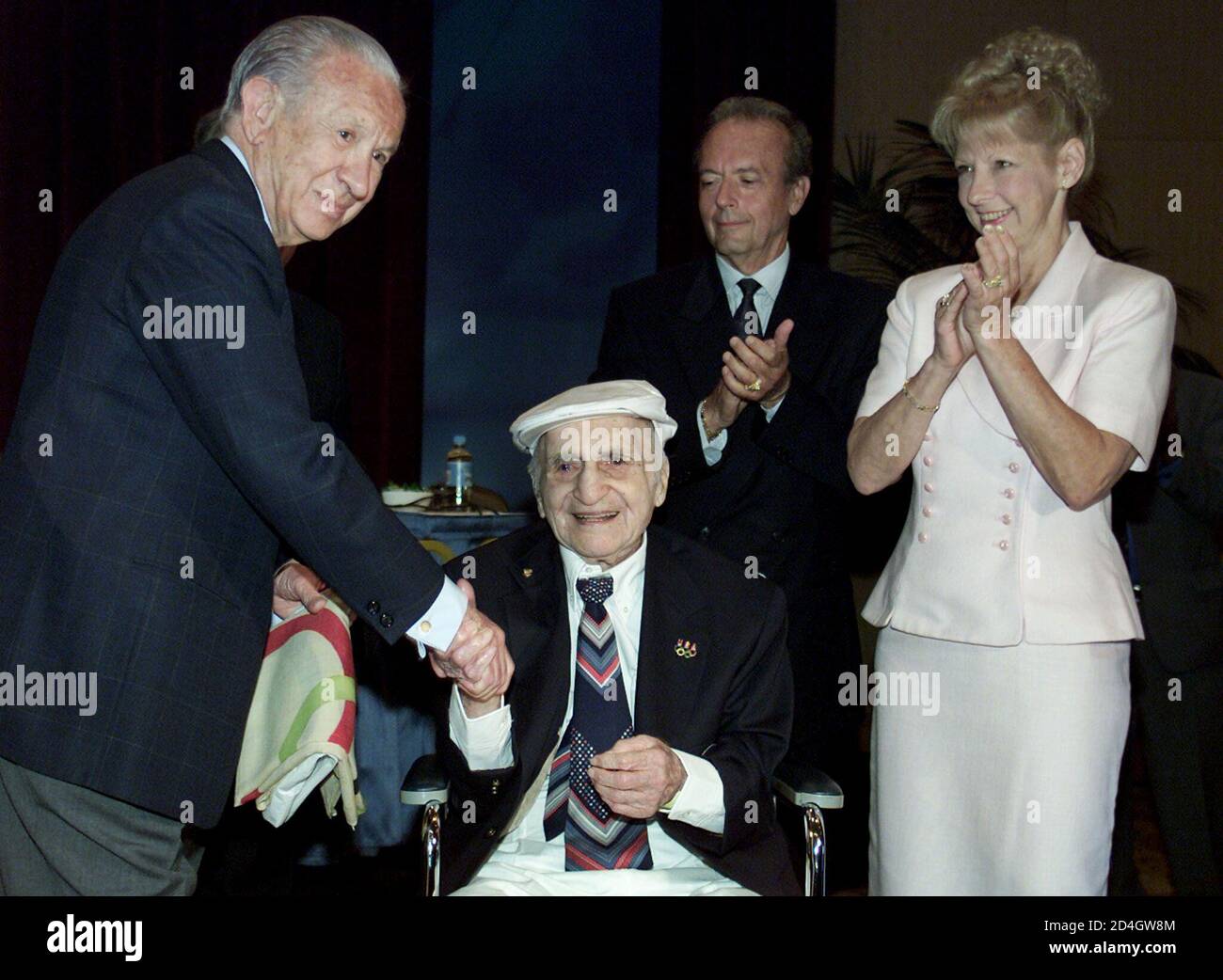 The President of the International Olympic Committee (IOC), Juan Antonio  Samaranch (L), shakes the hand of 103-year-old former United States  Olympian Harry Prieste (2nd from L) as Dr Nicolas LaMaina and his