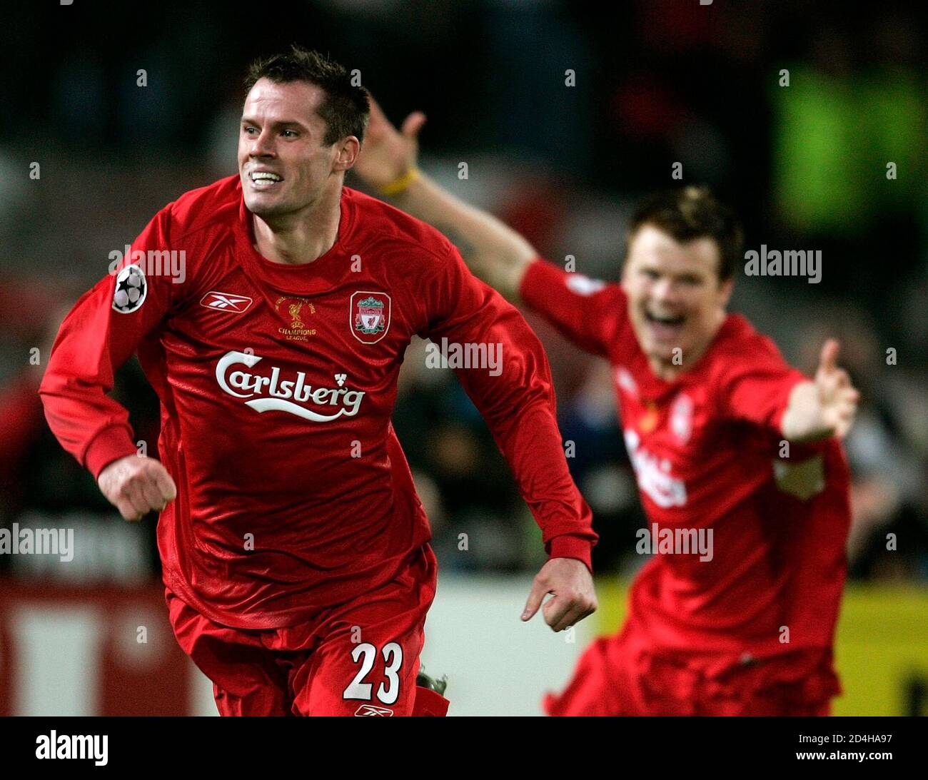 Liverpool's Carragher and Riise run on the pitch to celebrate their victory  over AC Milan in their Champions League final soccer match in Istanbul.  Liverpool's English defender Jamie Carragher (L) and Norwegian