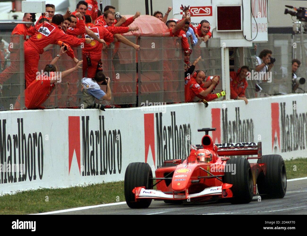 Ferrari Team Members Celebrate As German Formula One World Champion Michael Schumacher Crosses The Finish Line To Win The Spanish Formula One Grand Prix At The Circuit De Catalunya April 29 01 Michael