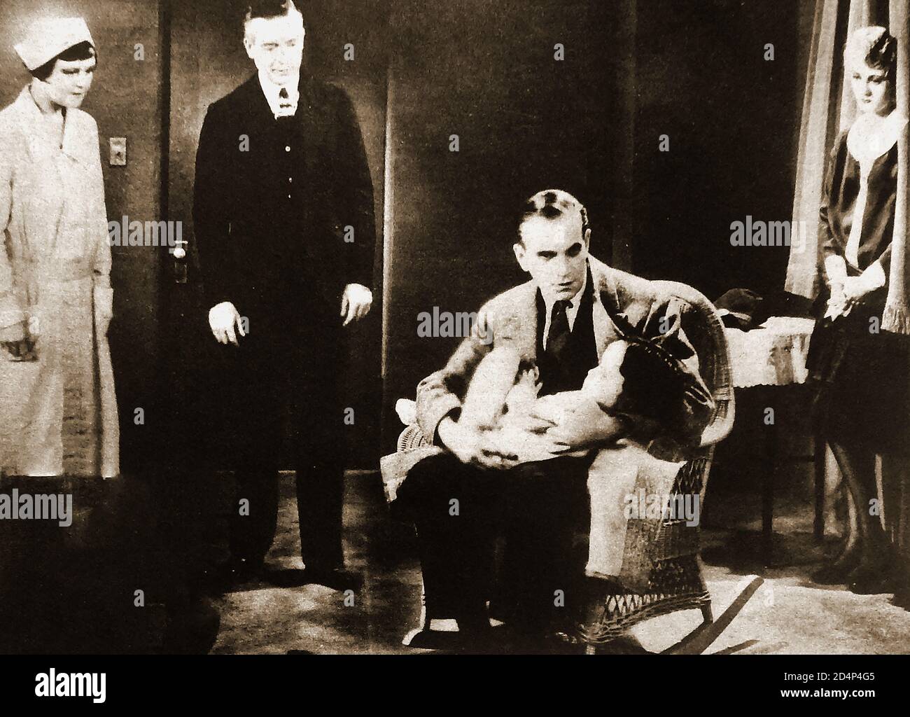 1928 Al Jolson apparaissant dans The Singing Fool, l'un des premiers (en partie) films talkie. The Singing Fool était un film de théâtre musical américain de 1928 réalisé par Lloyd Bacon. Sortie par Warner Bros, avec Al Jolson à blackface. Il faisait suite à son film précédent, le chanteur de Jazz. Le film a été publié en versions audio et silencieuse. Le film a fait de Davey Lee Jolson fils et de la co-star de 31⁄2 ans, la plus populaire des enfants depuis Jackie Coogan Banque D'Images