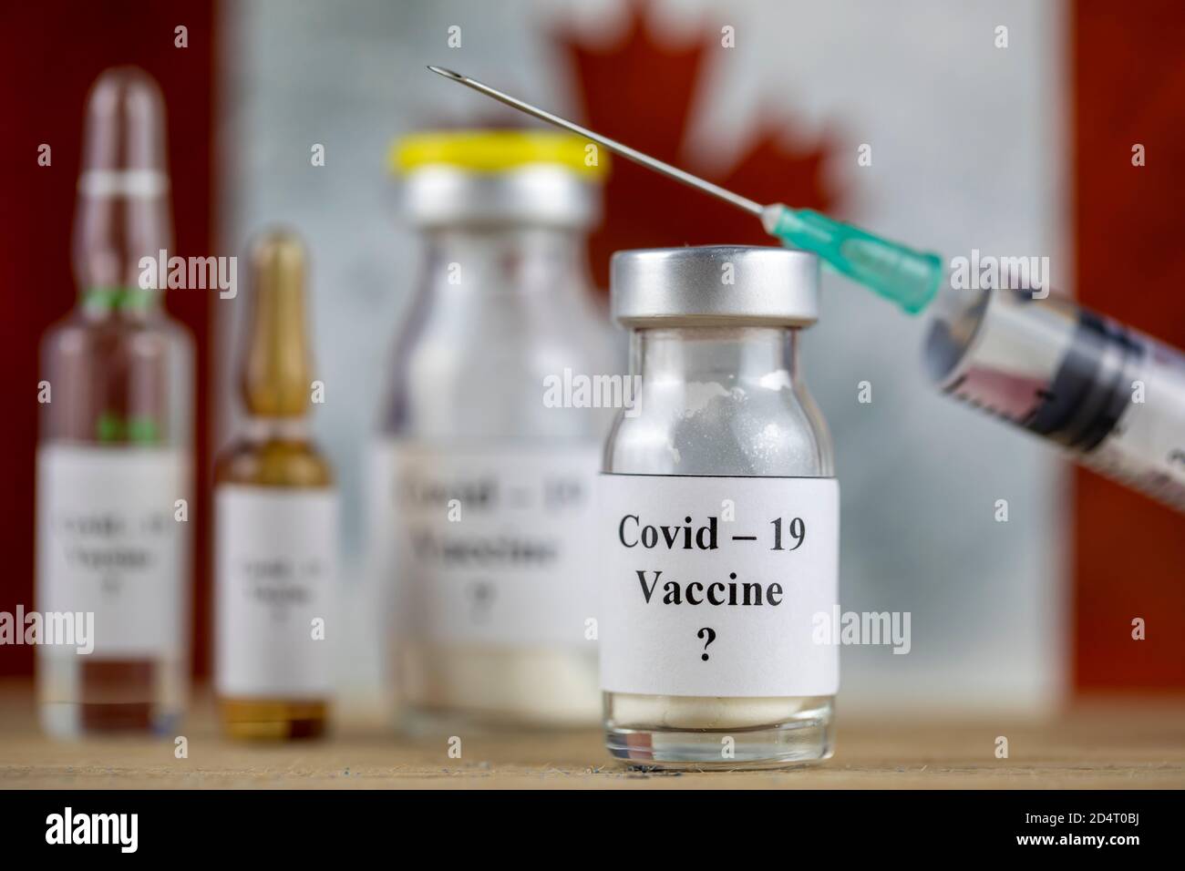 Canada drapeau et bouteille avec vaccin et seringue, coronavirus, Covid-19, concept de médecine, science et santé Banque D'Images