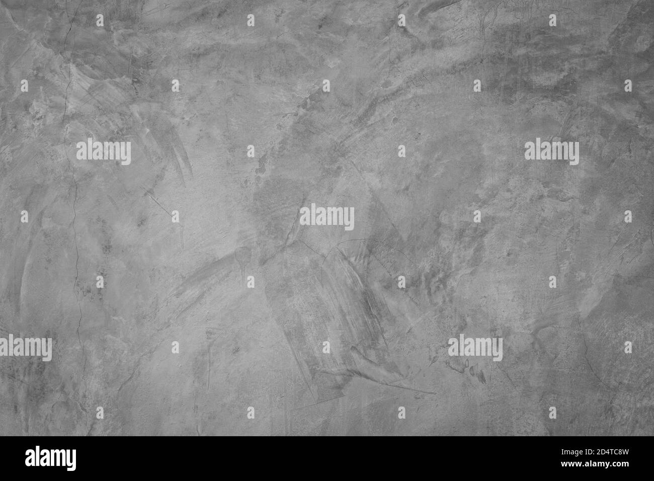 Texture de la surface de la paroi en béton gris. Quelques fissures et rayures, adaptées à une utilisation comme image de motif ou d'arrière-plan. Banque D'Images